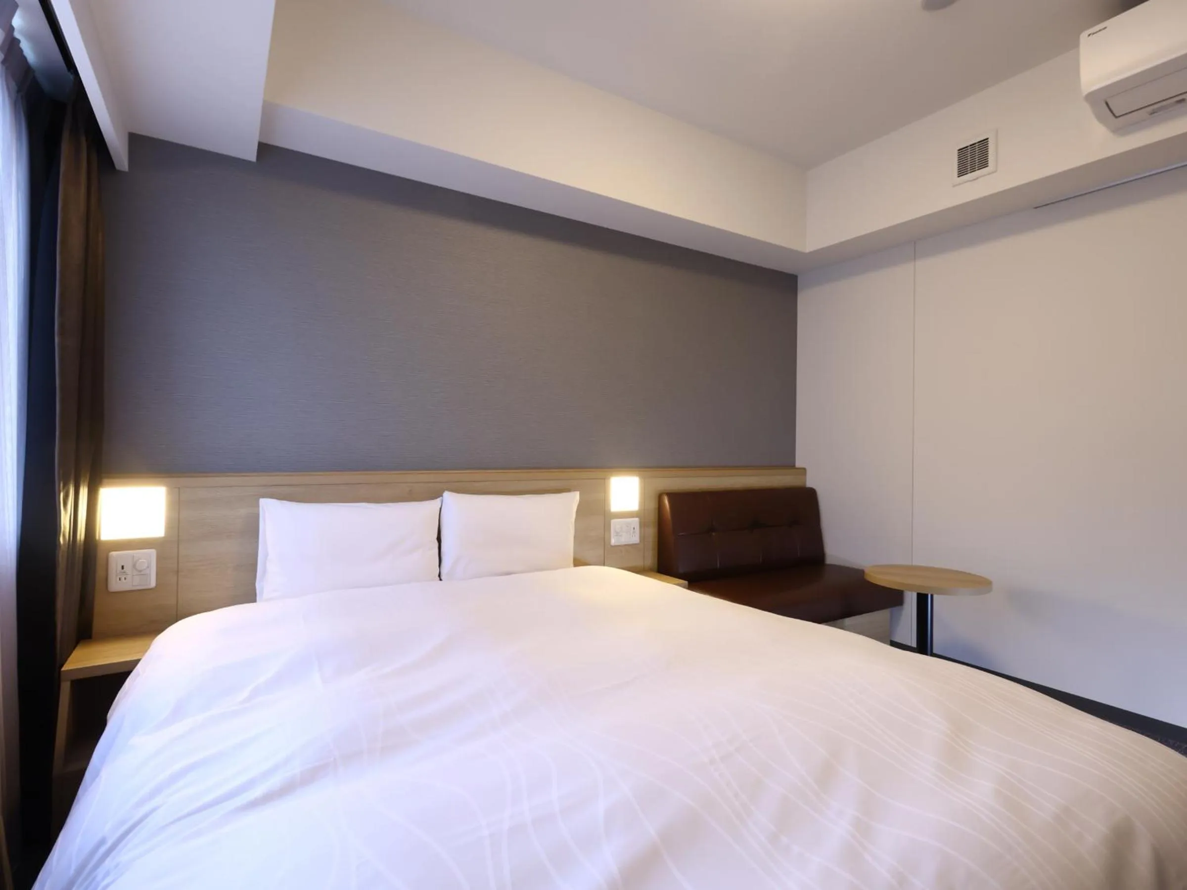 Bed in Dormy Inn Hiroshima Annex