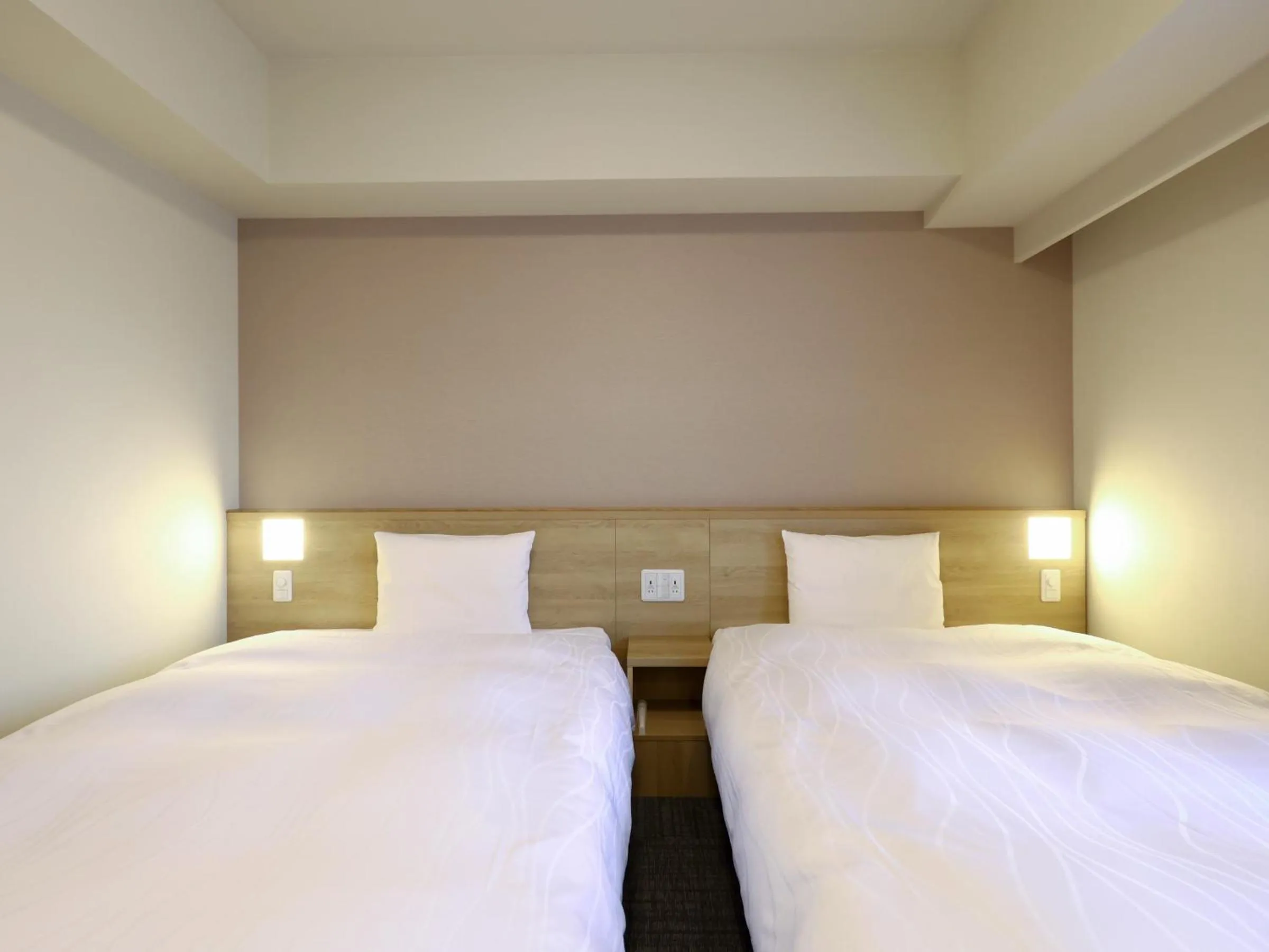 Bed in Dormy Inn Hiroshima Annex