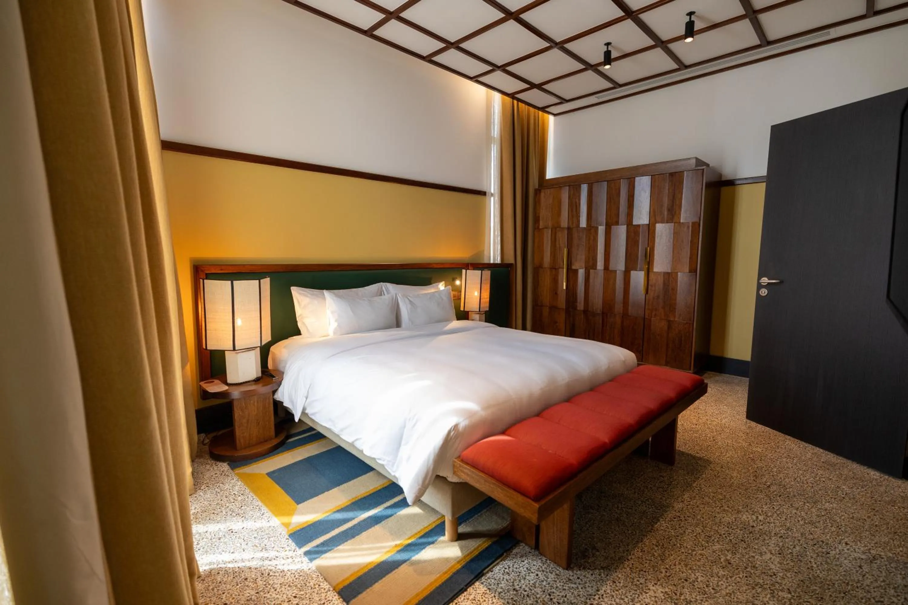 Bed in La Maison Palmier Abidjan, a Member of Design Hotels