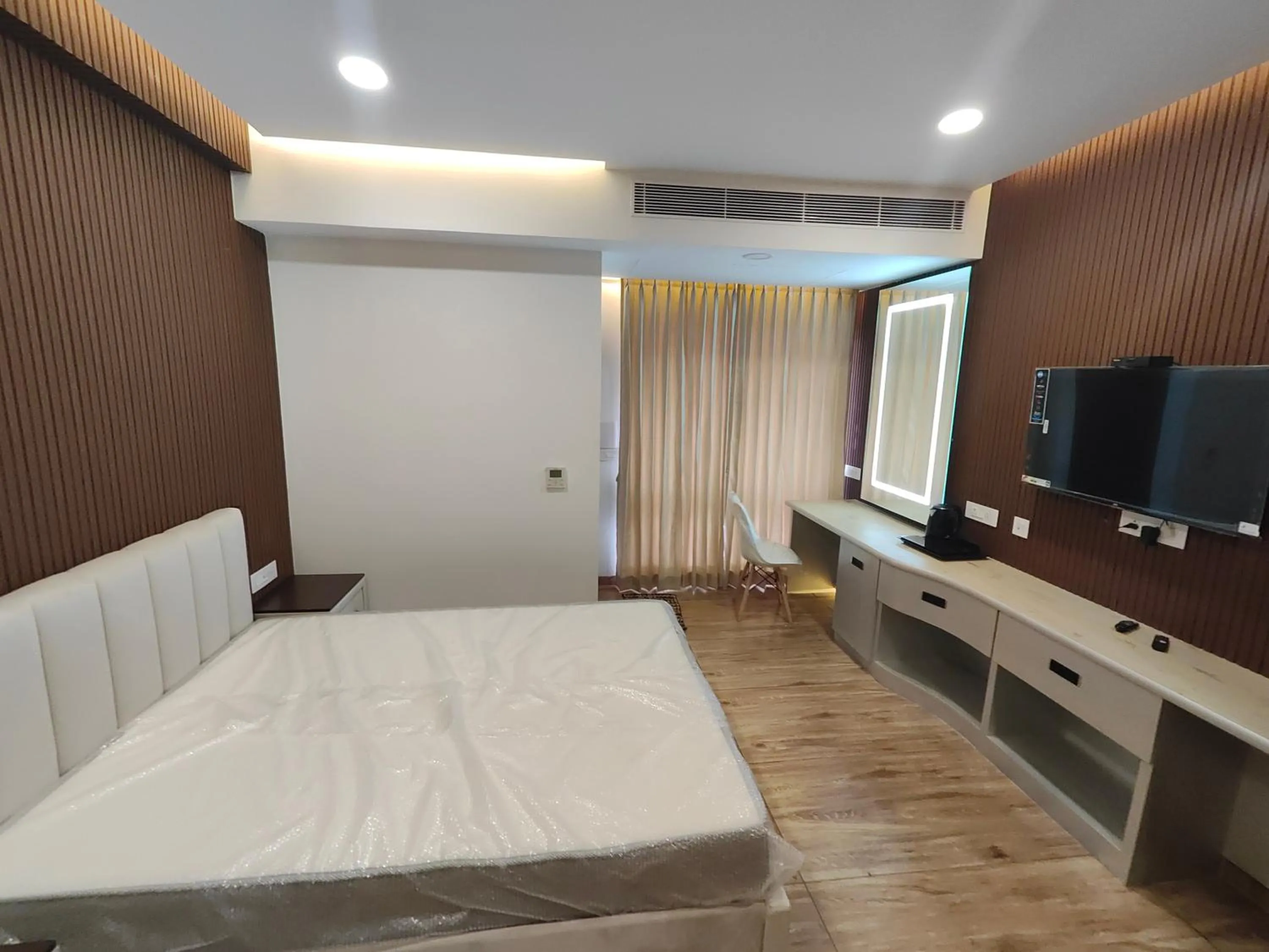 Bed in Hotel Geetha International