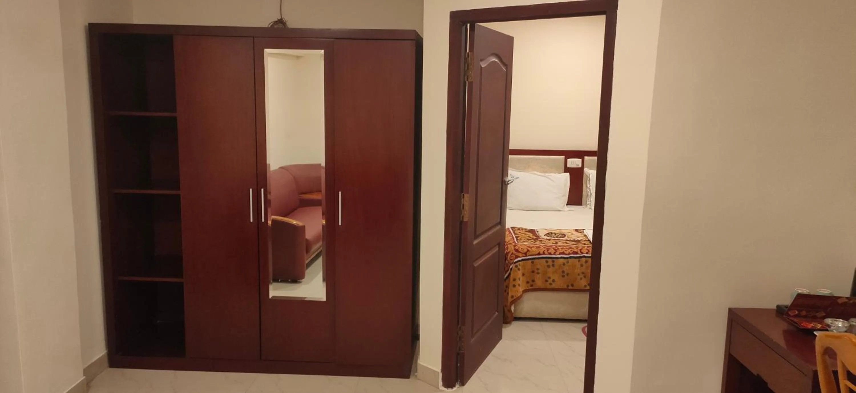 wardrobe, Bed in Hotel Geetha International