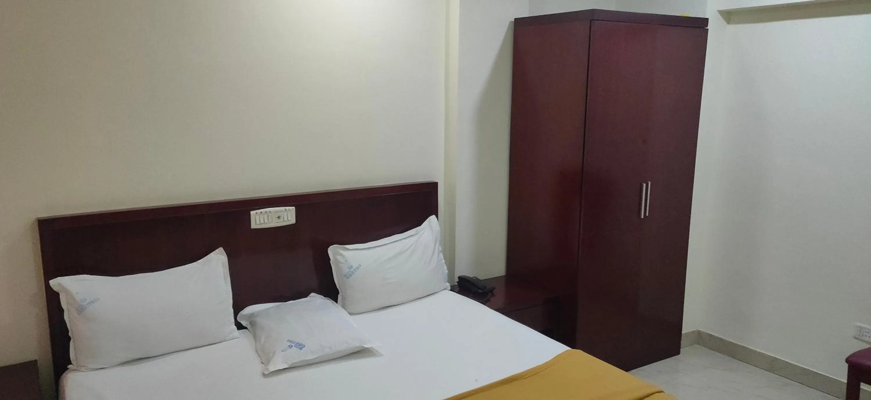 wardrobe, Bed in Hotel Geetha International