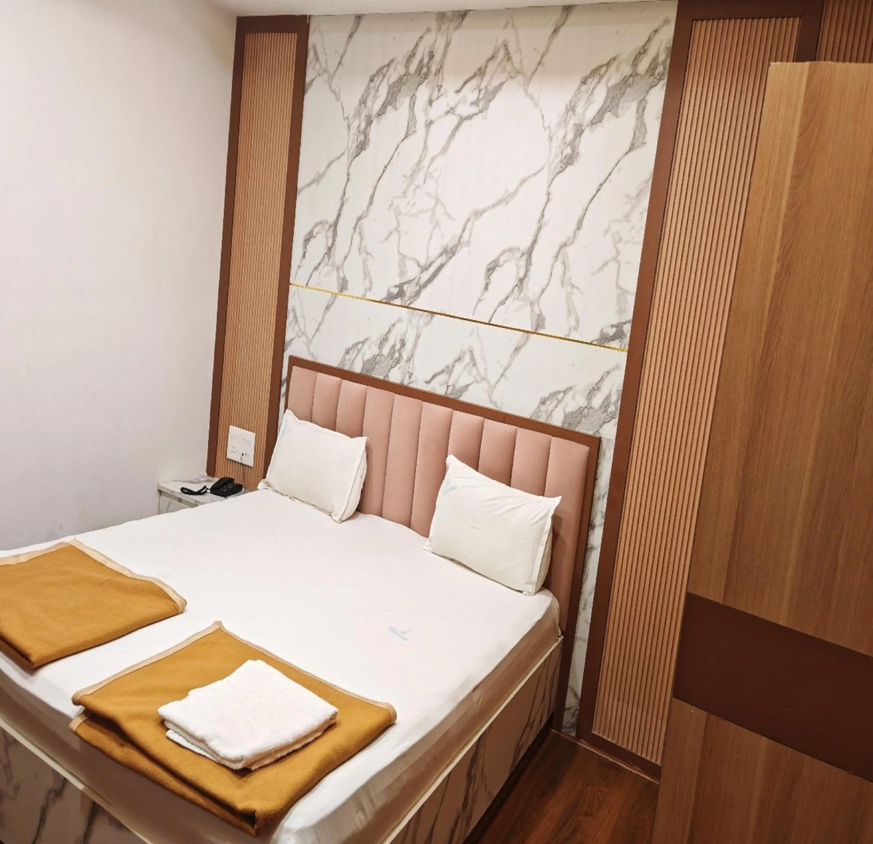 Bed in Hotel Geetha International