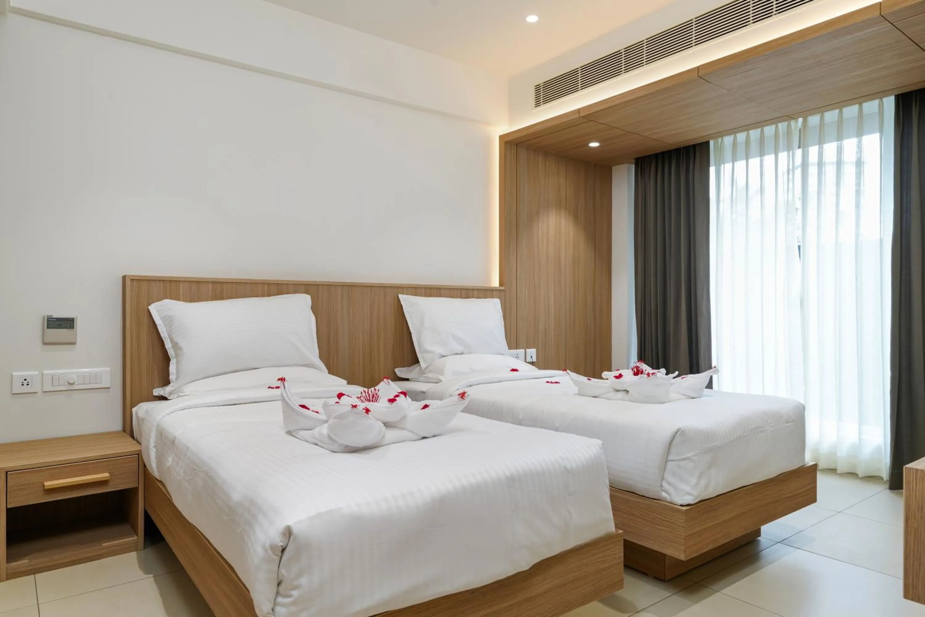 Bed in The Trios Hotel