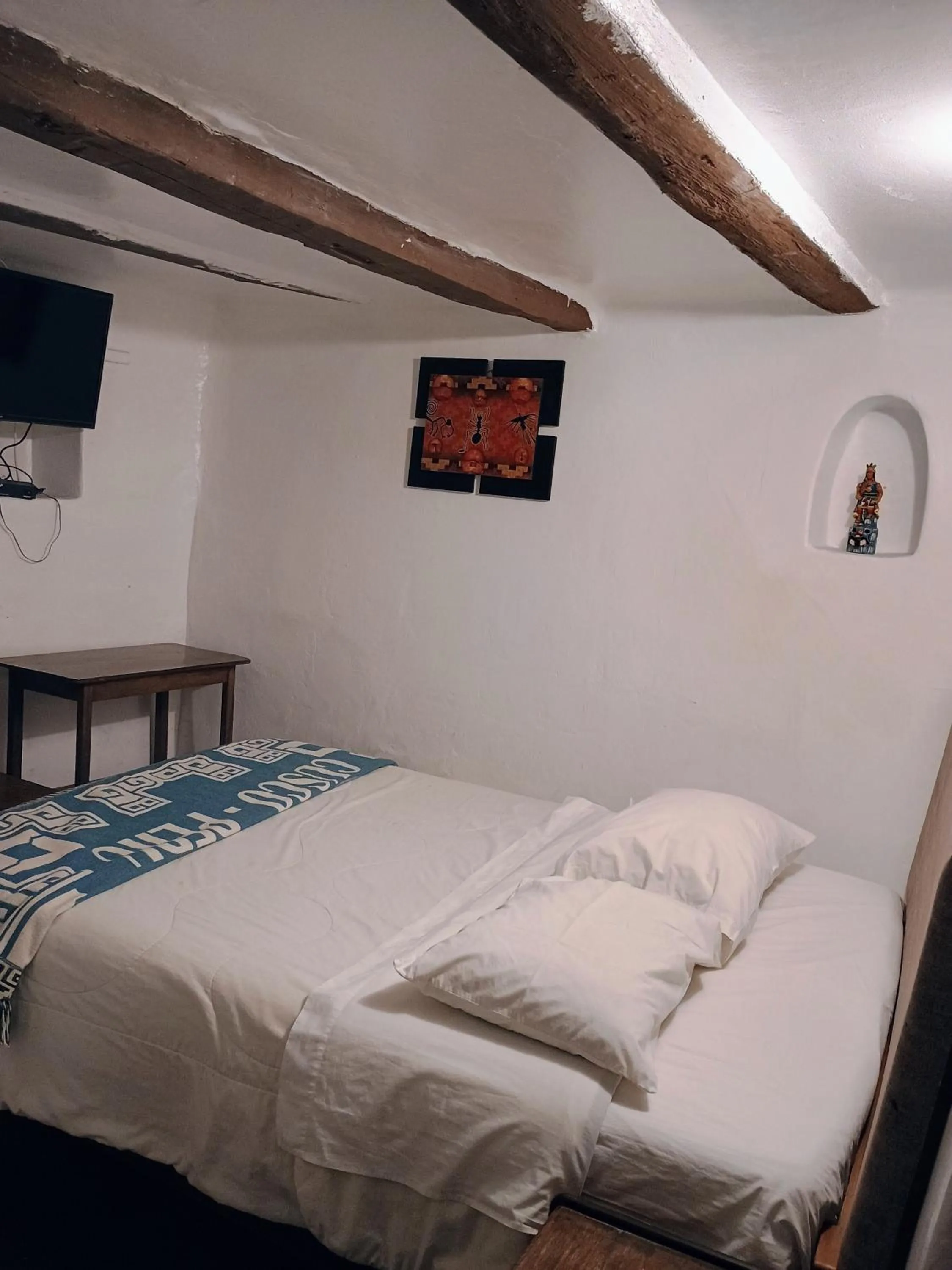 Bed in Posada Catama INN