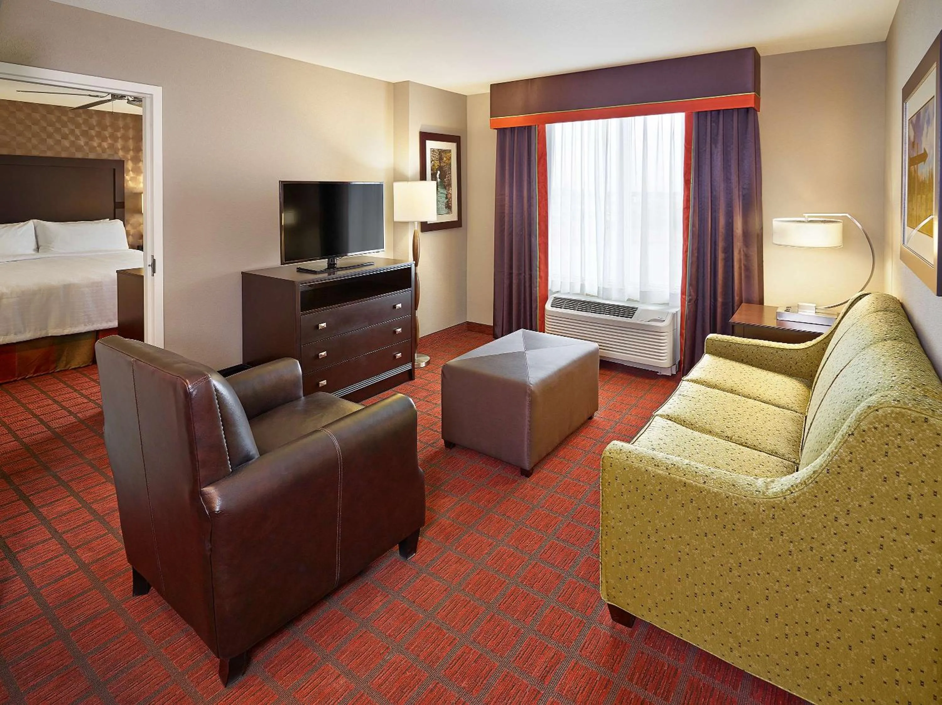 Living room, Bed in Homewood Suites Calgary Airport