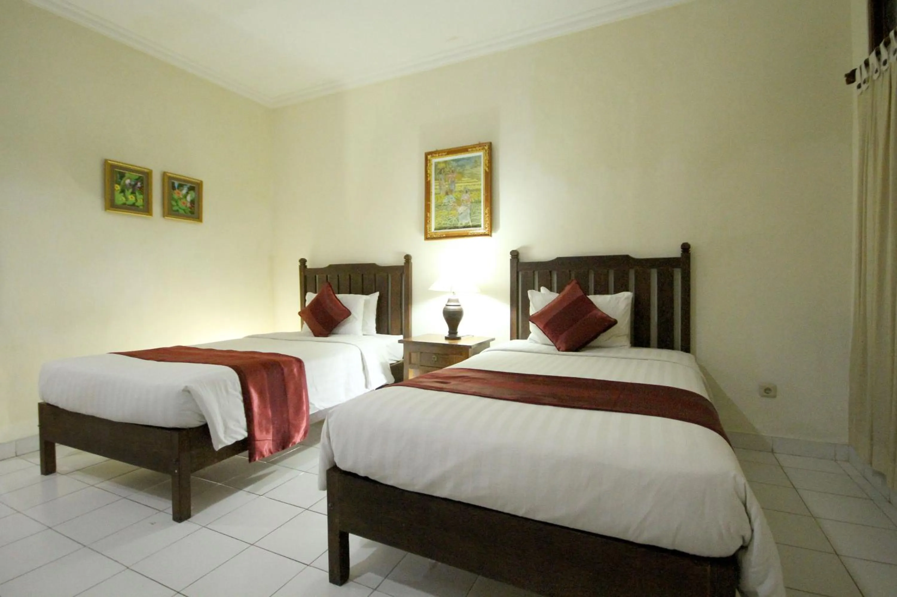 Bed in Swastika Guesthouse Sanur