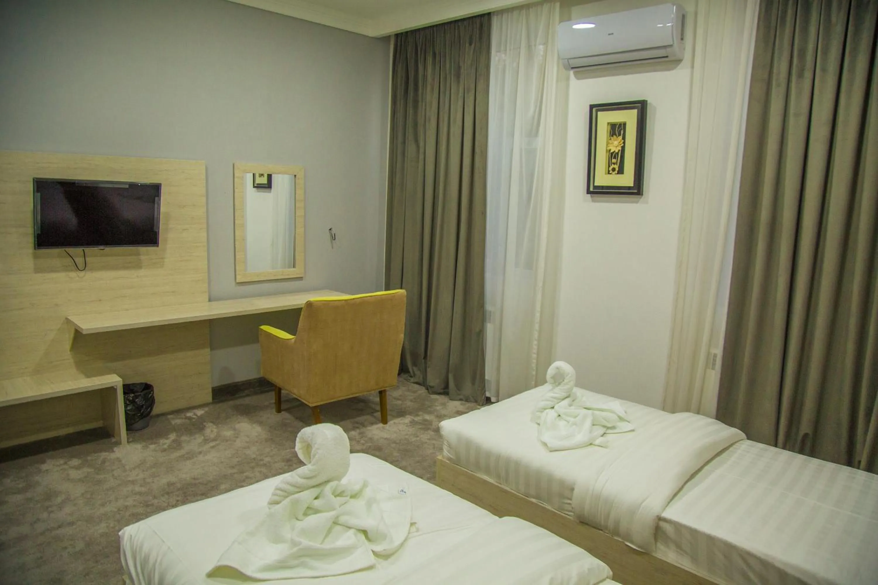 Communal lounge/ TV room, Bed in South Hotel Tashkent