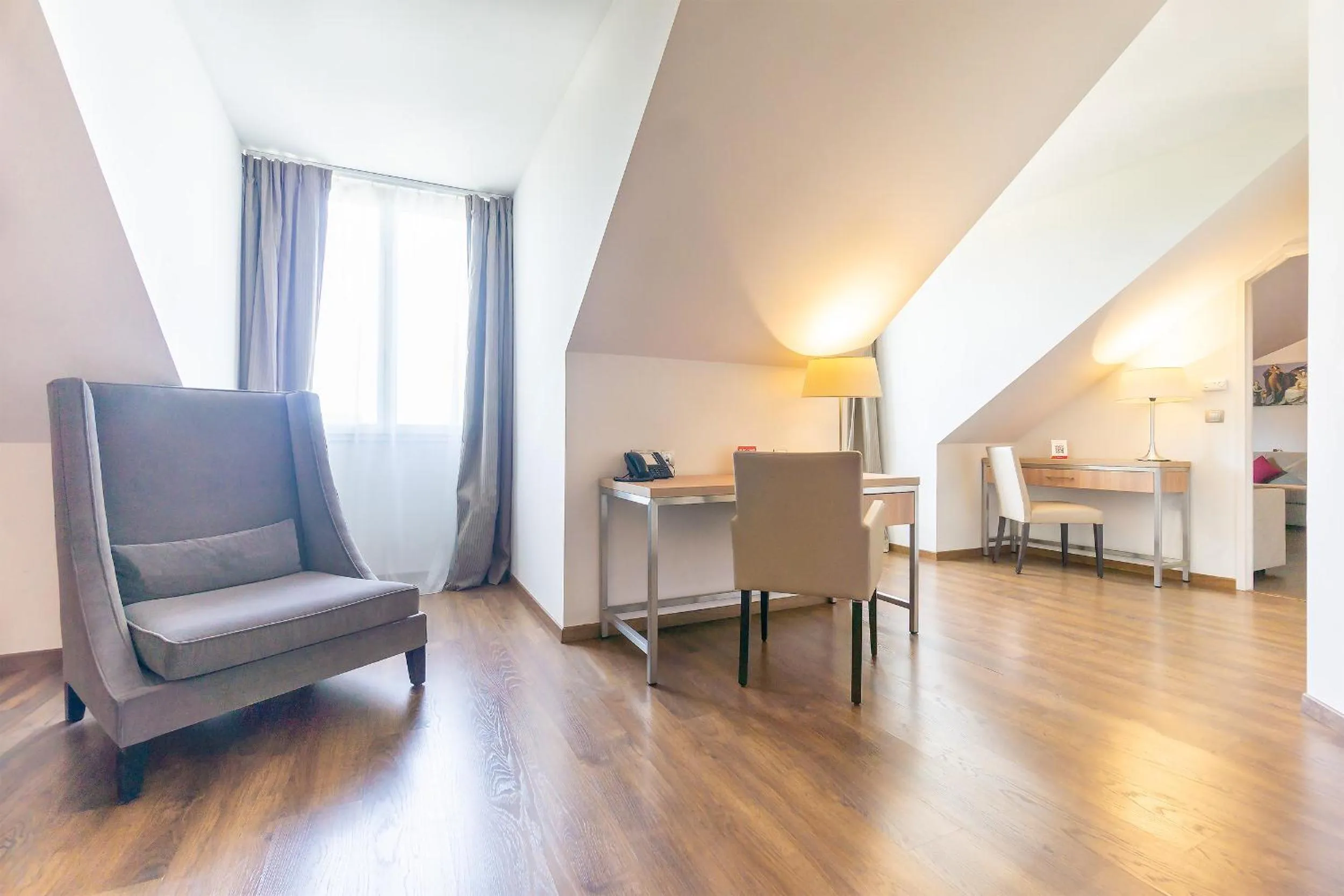 Seating area in City Résidence Paris CDG Airport