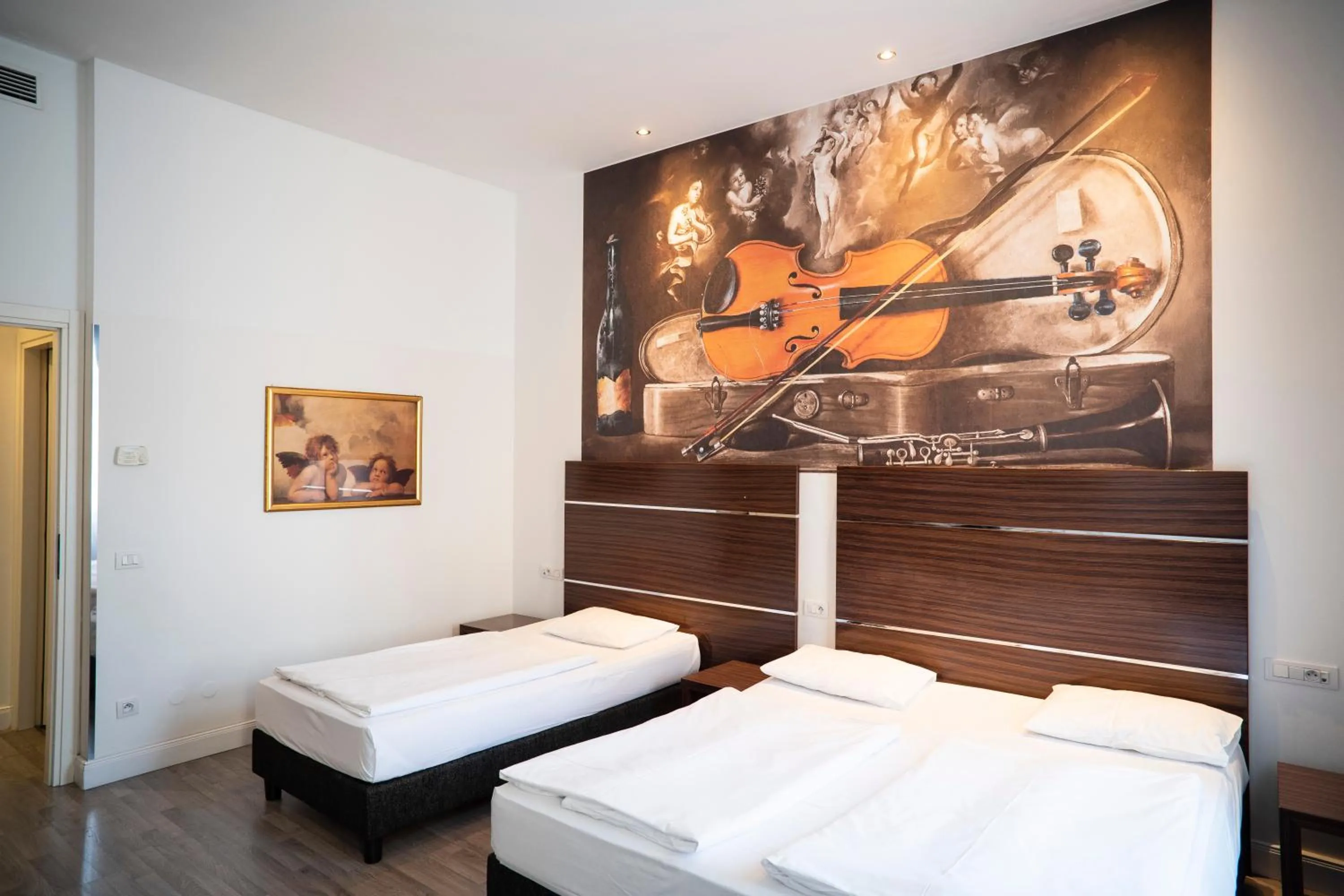 Bed in Hotel Assenzio Prague