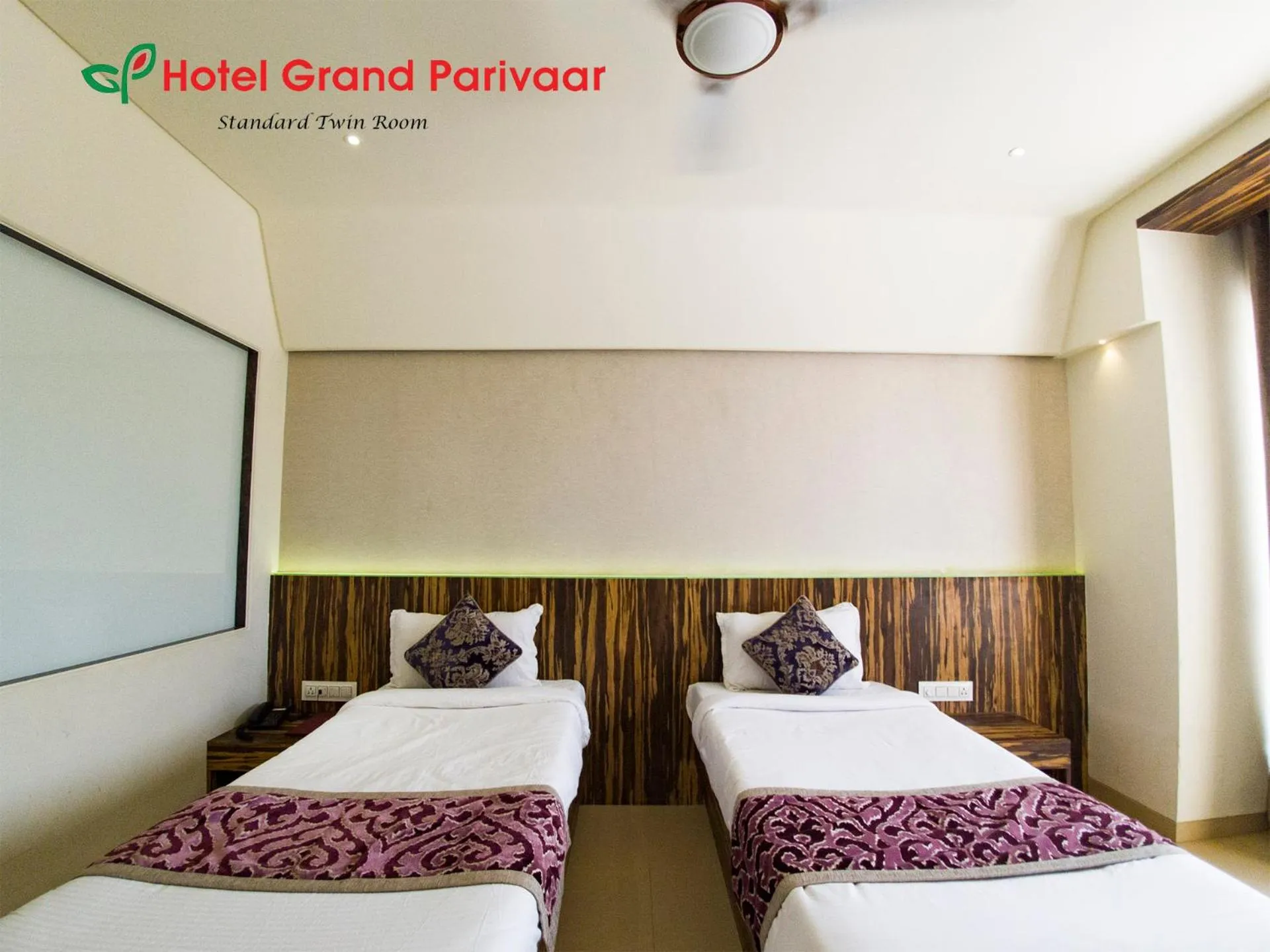 Bed in Hotel Grand Parivaar