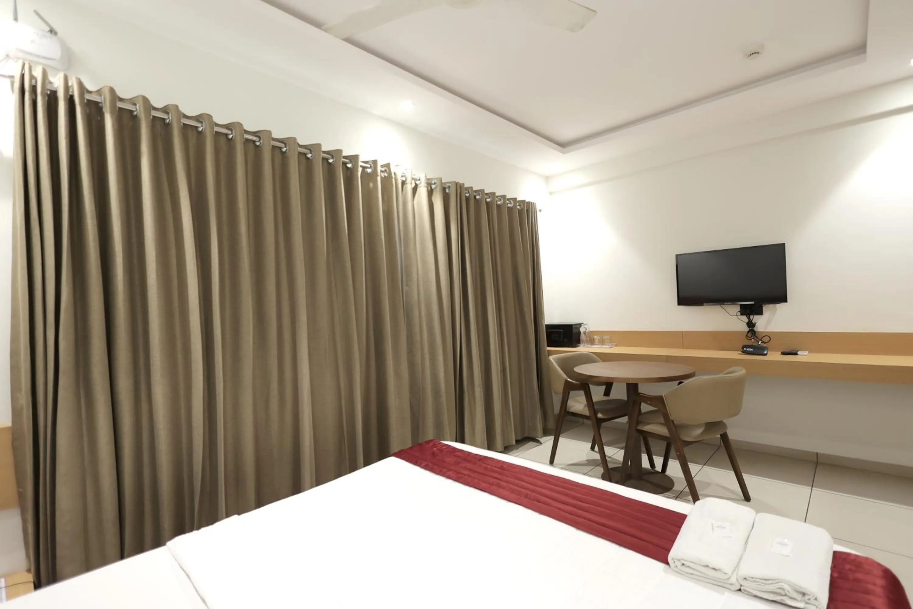 Bedroom in Hotel Shagun, Piplod City Centre Surat