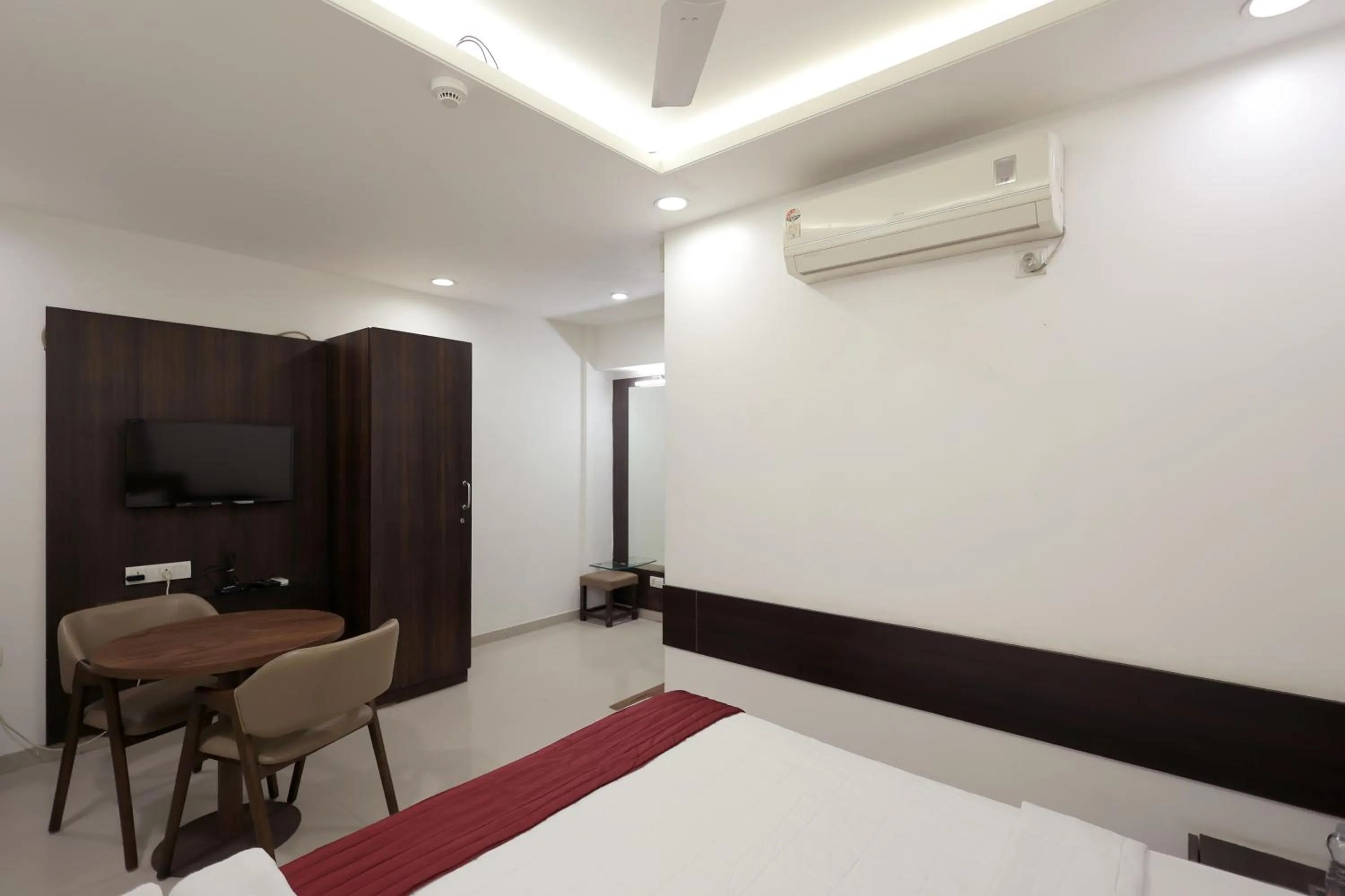 Bedroom in Hotel Shagun, Piplod City Centre Surat