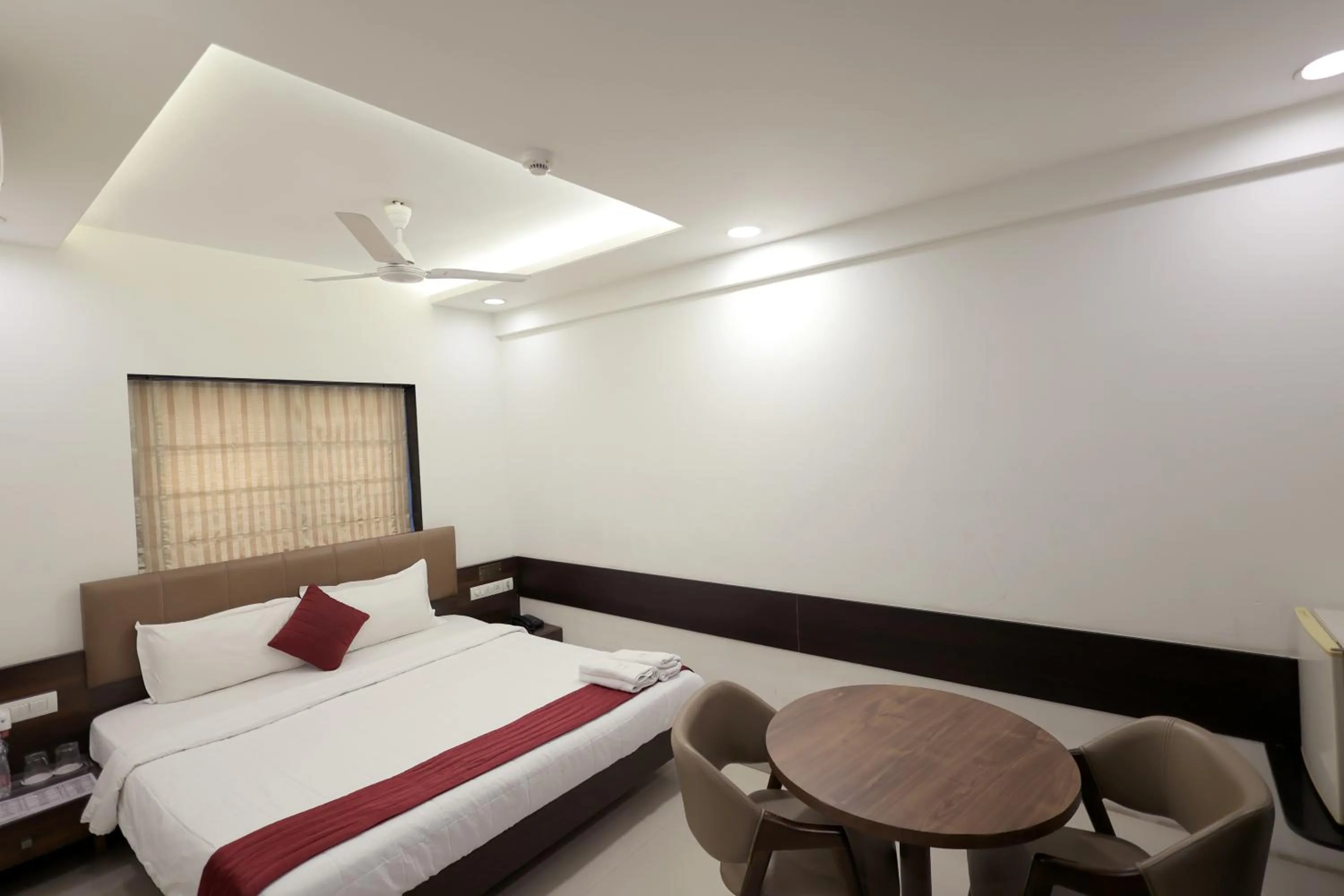 Bedroom in Hotel Shagun, Piplod City Centre Surat