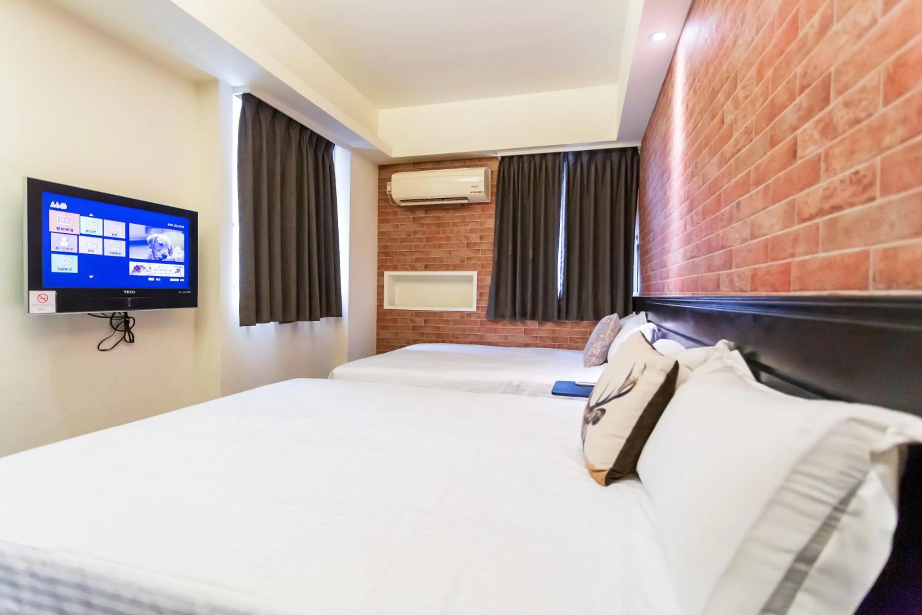 Bed in Newrise Hotel