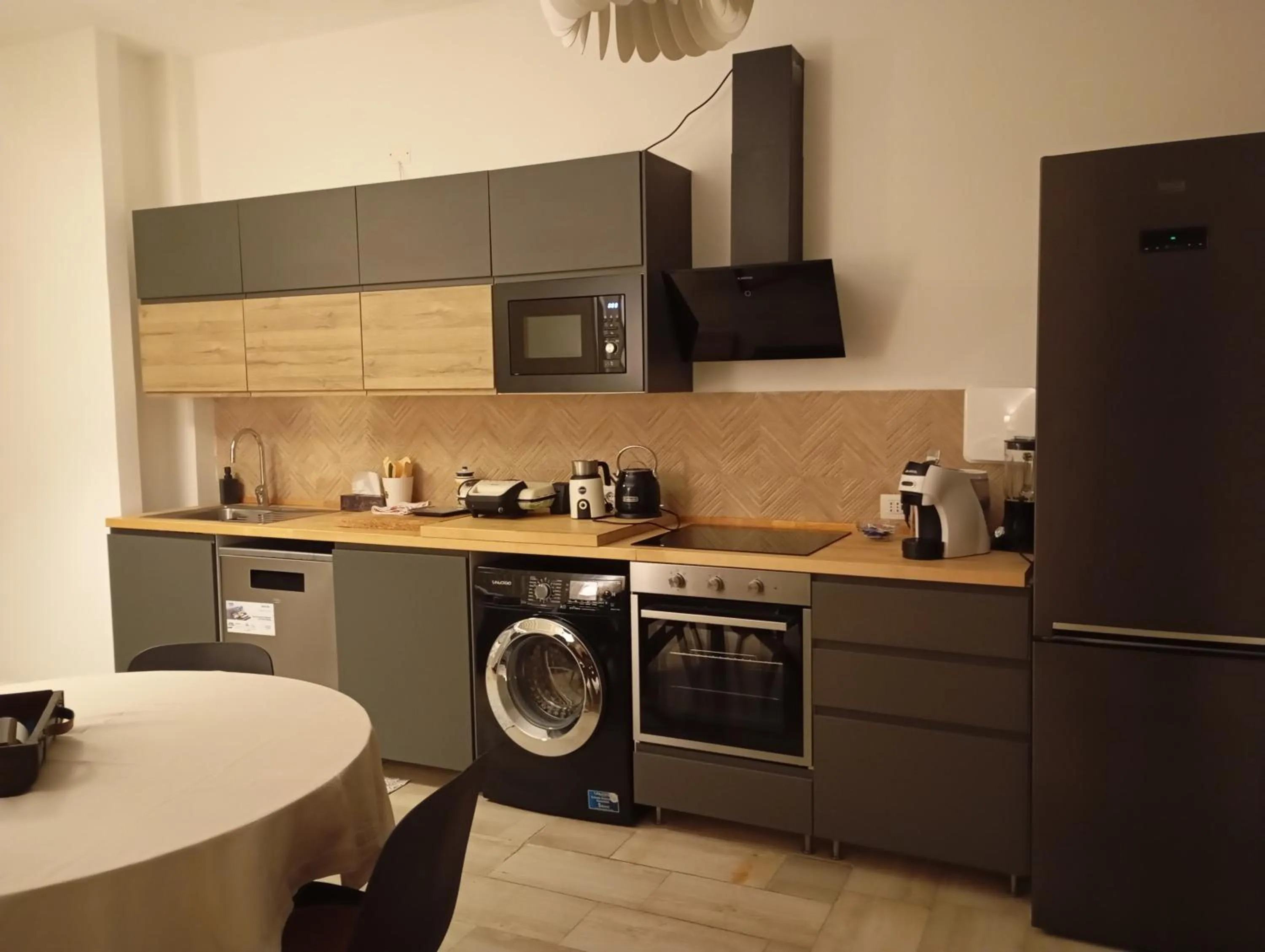 Kitchen or kitchenette in Aparthotel Masseria Villa Marchesi