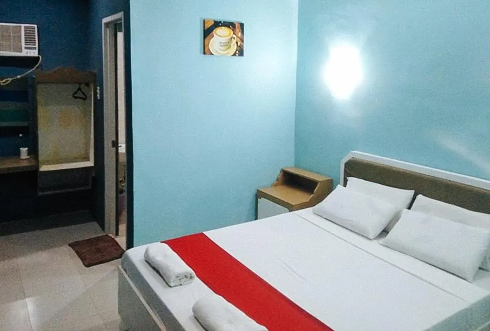 Bed in RedDoorz at EM Pensiontel Butuan City