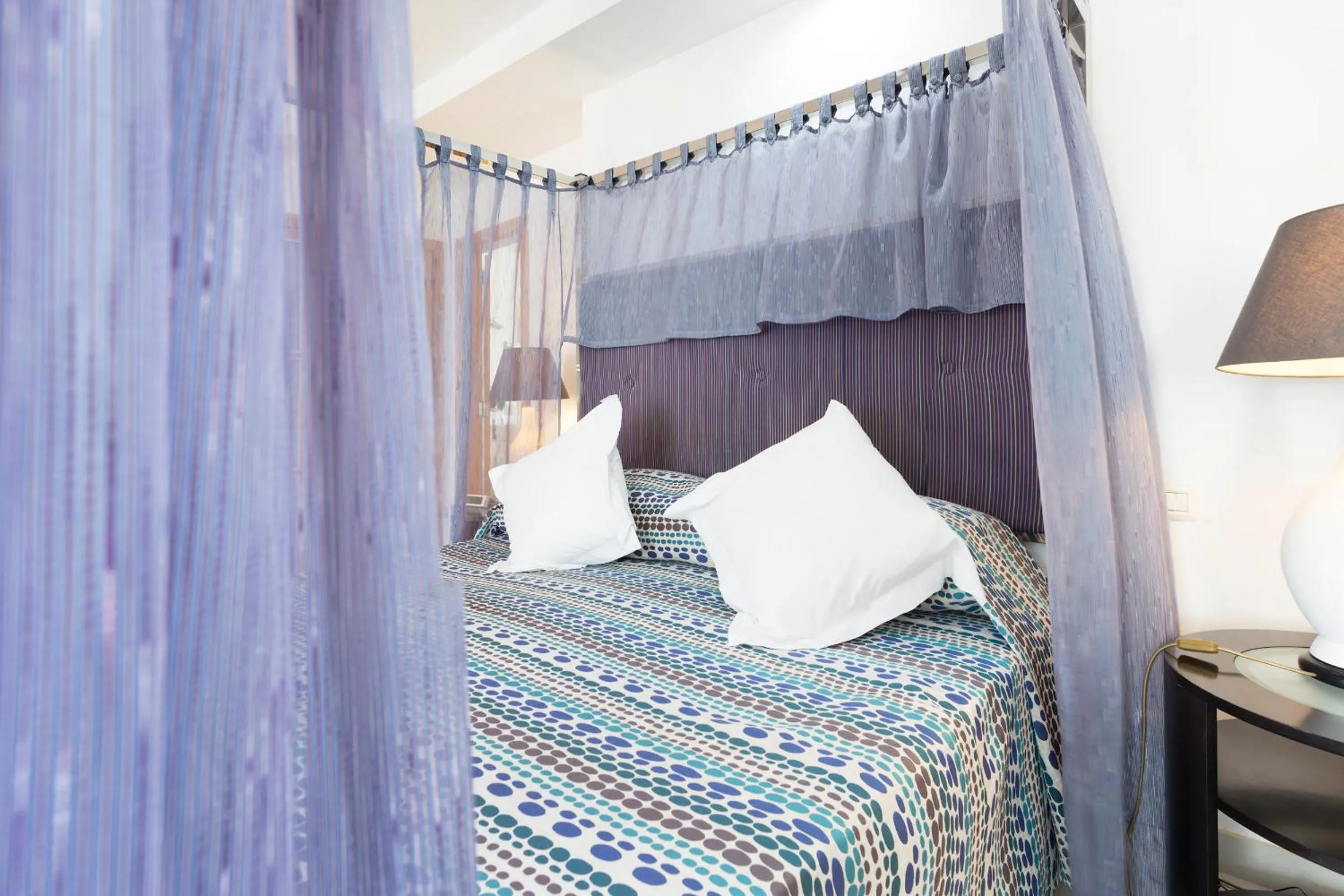 Bed in Atlas Suites Tenerife by EnjoyaHome