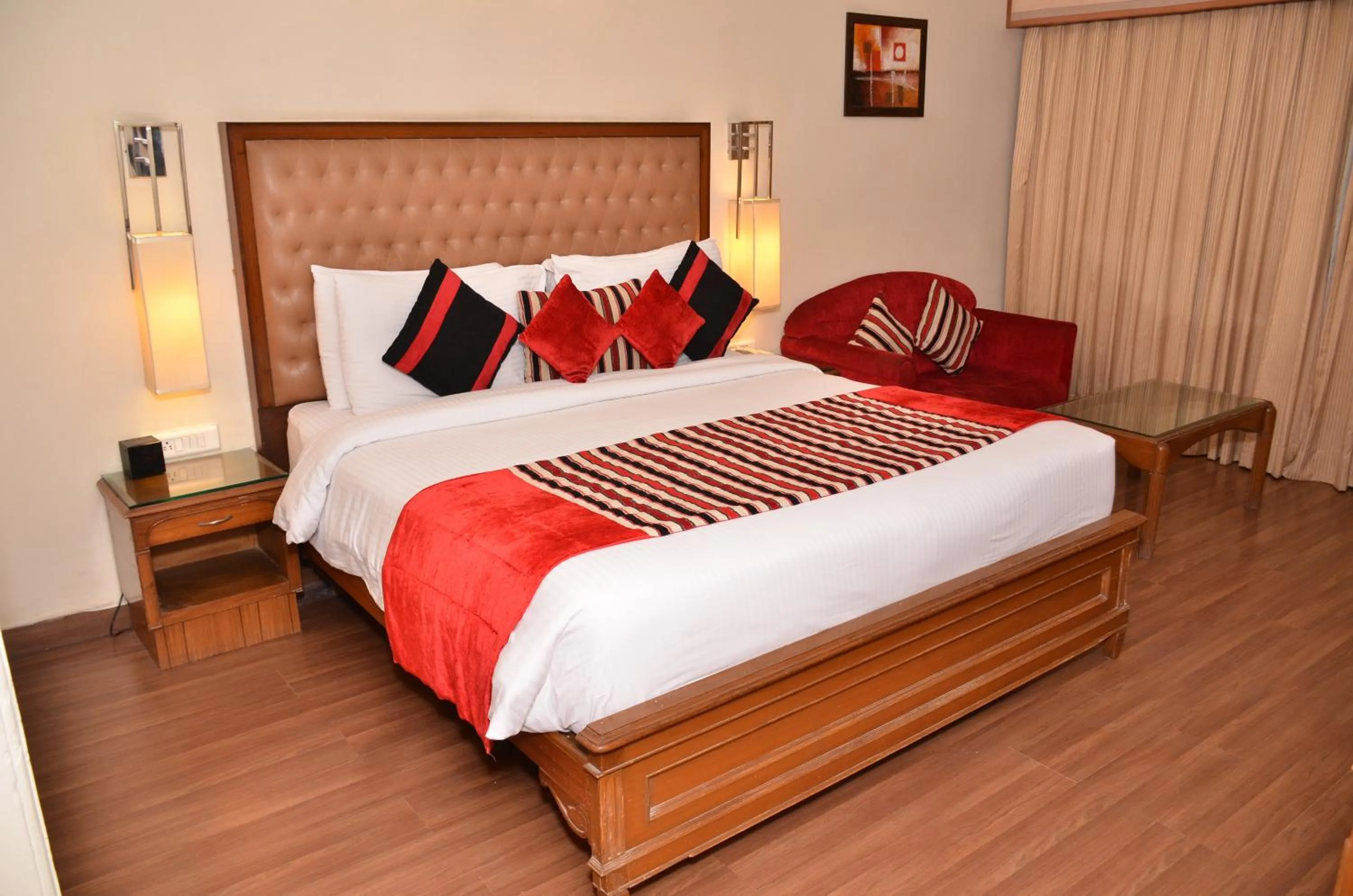 Living room, Bed in Regenta Place Amritsar by Royal Orchid Hotels Limited
