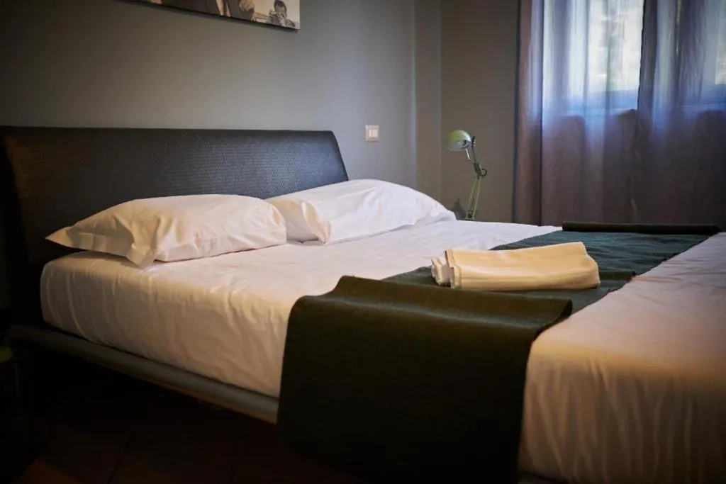 Bed in Colonna Rooms & apartment