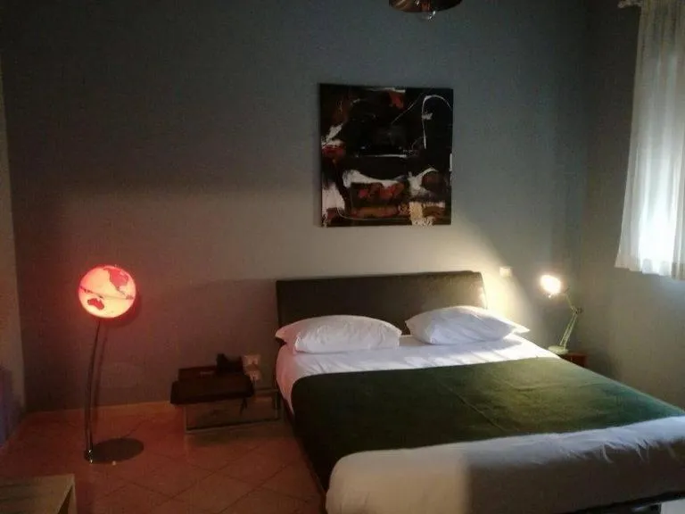 Bed in Colonna Rooms & apartment