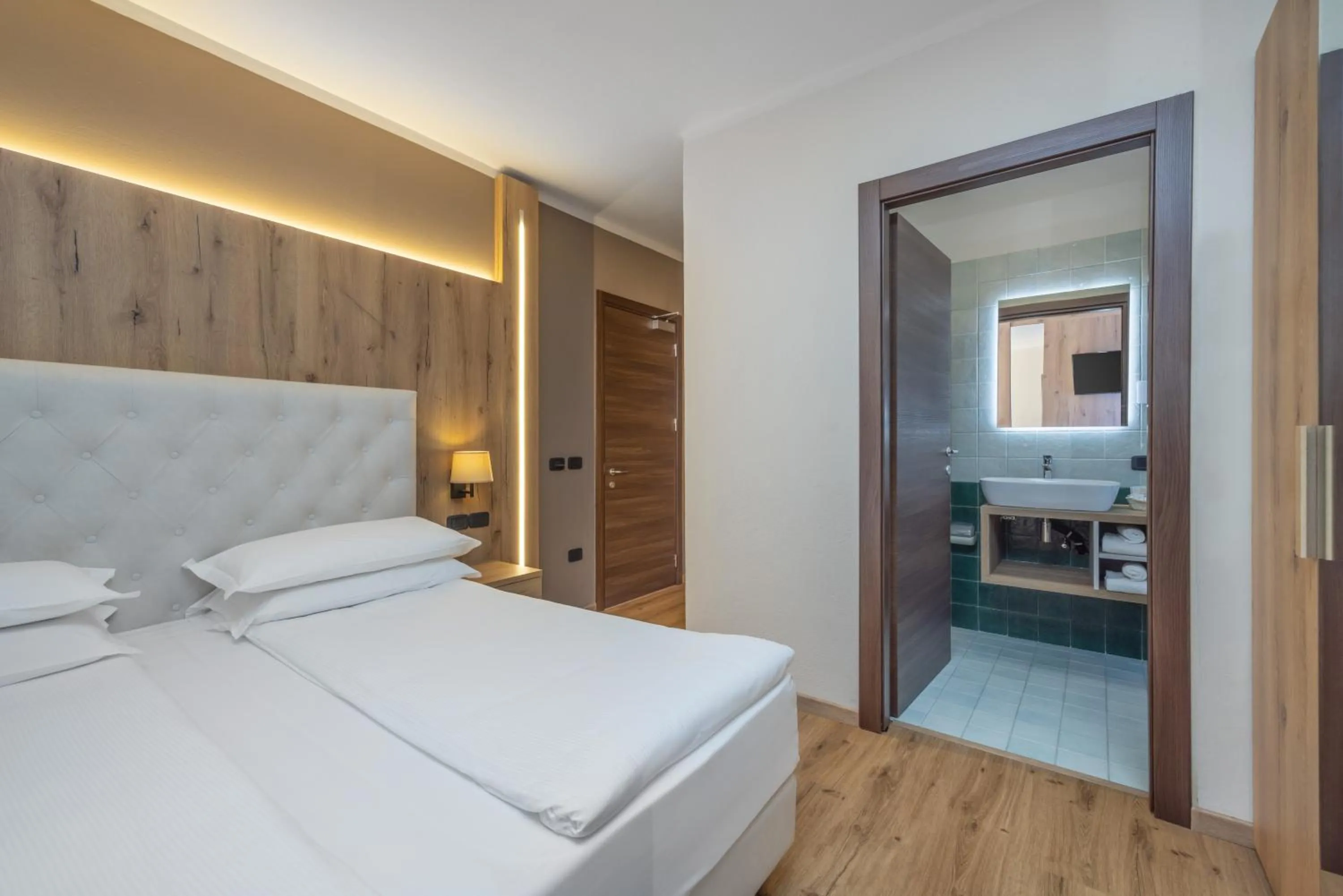 Bed in Garden Wellness Hotel S