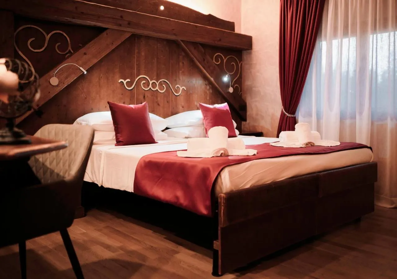 Bed in Garden Wellness Hotel S