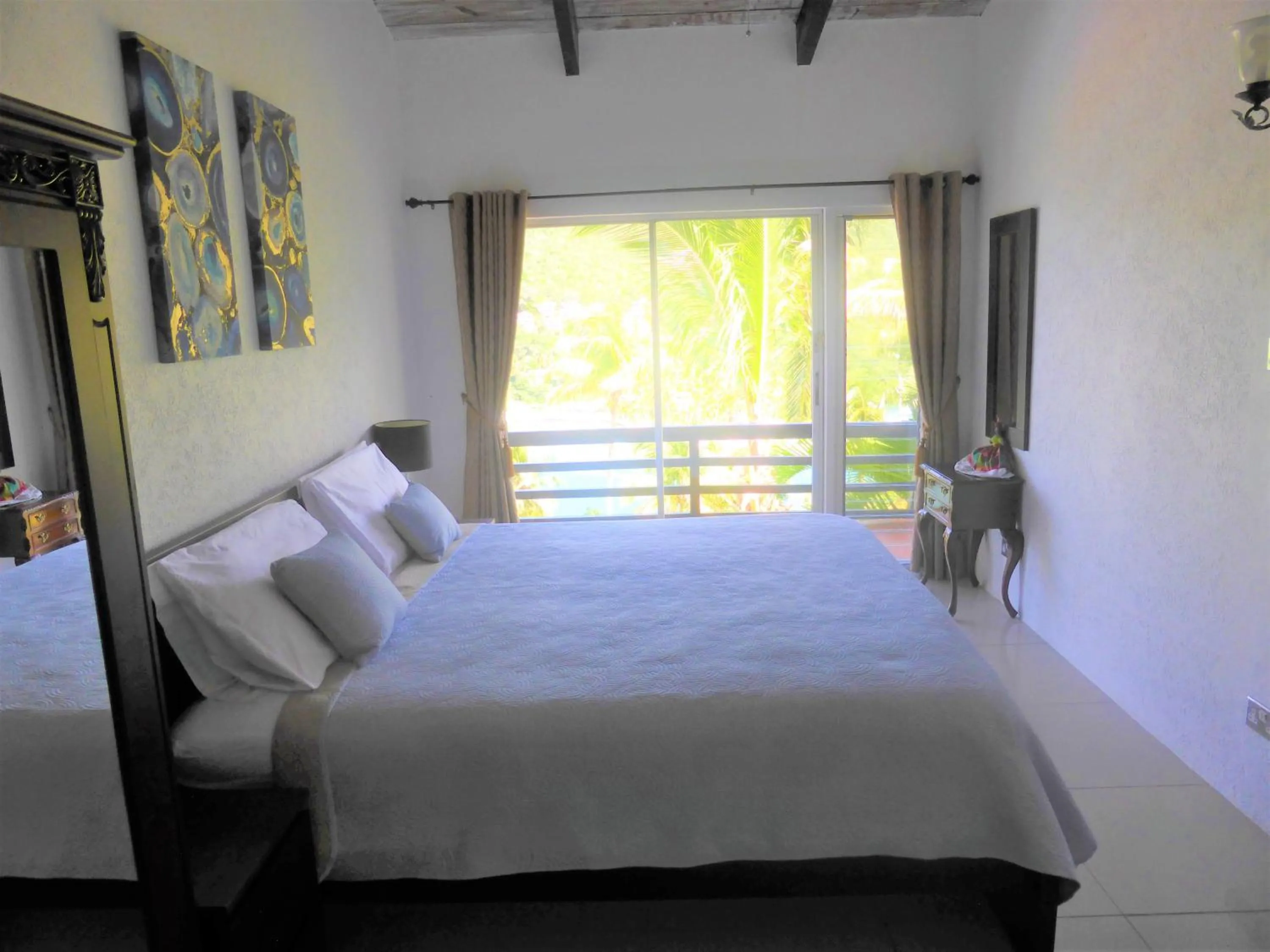 Photo of the whole room, Bed in Marigot Palms Luxury Caribbean Apartment Suites