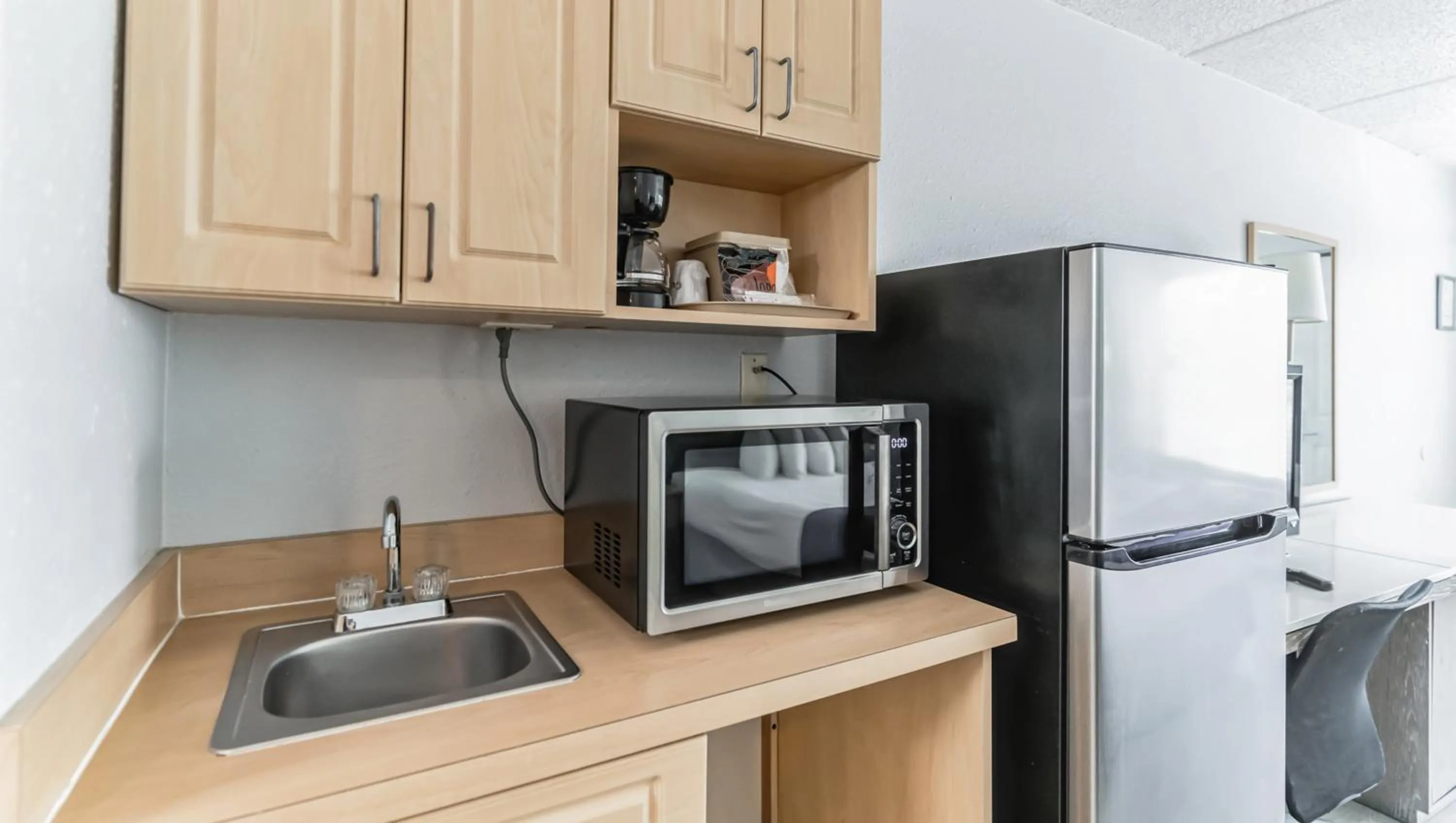 Kitchen or kitchenette in Home 1 Suites Extended Stay - Kissimmee