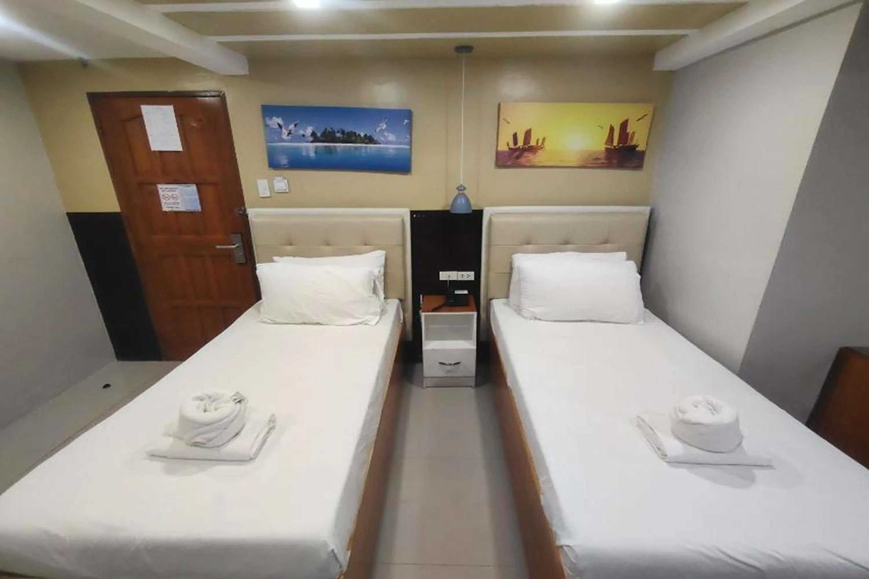 Photo of the whole room, Bed in Taj Hotel Tuguegarao