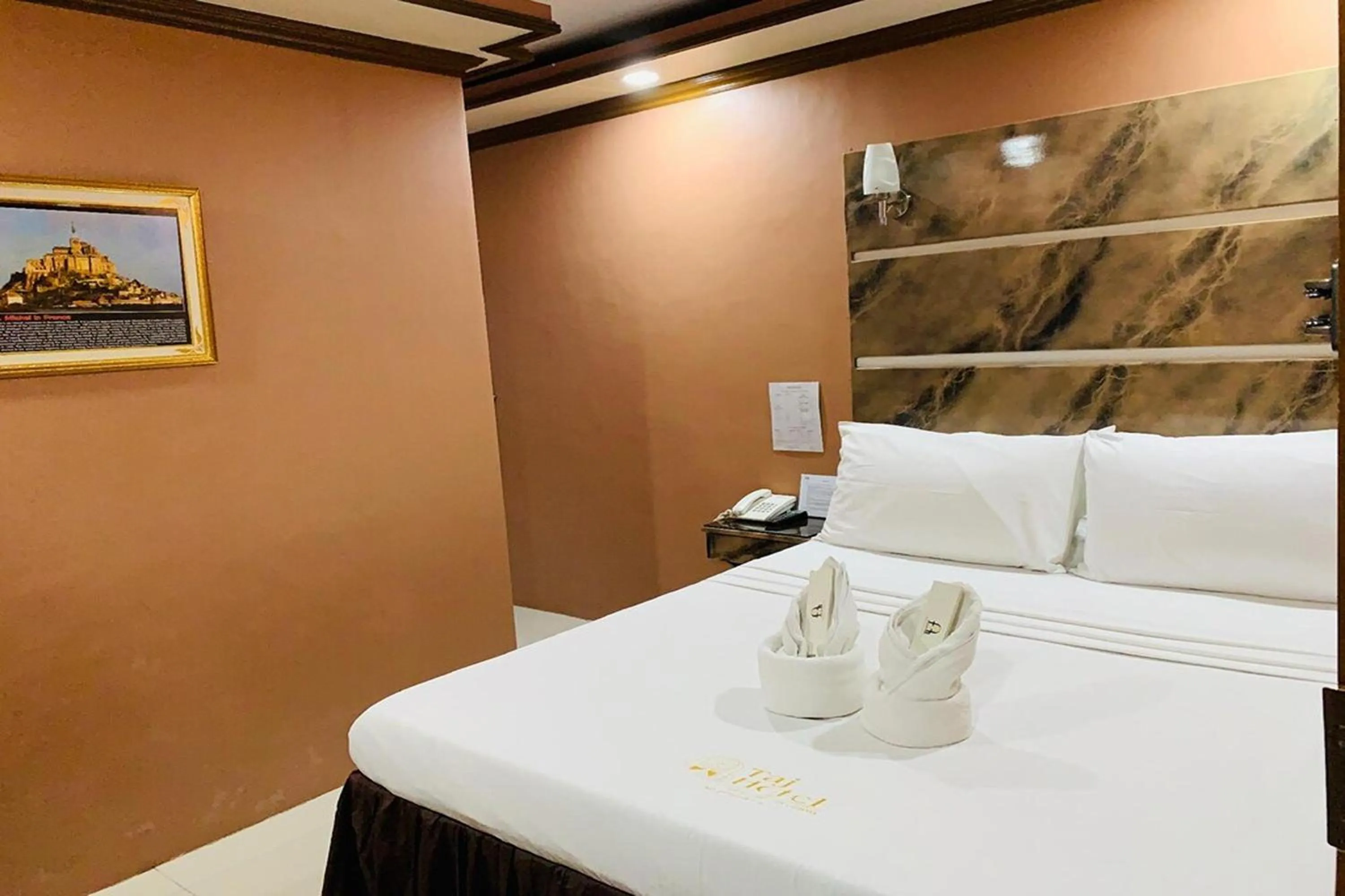 Photo of the whole room, Bed in Taj Hotel Tuguegarao