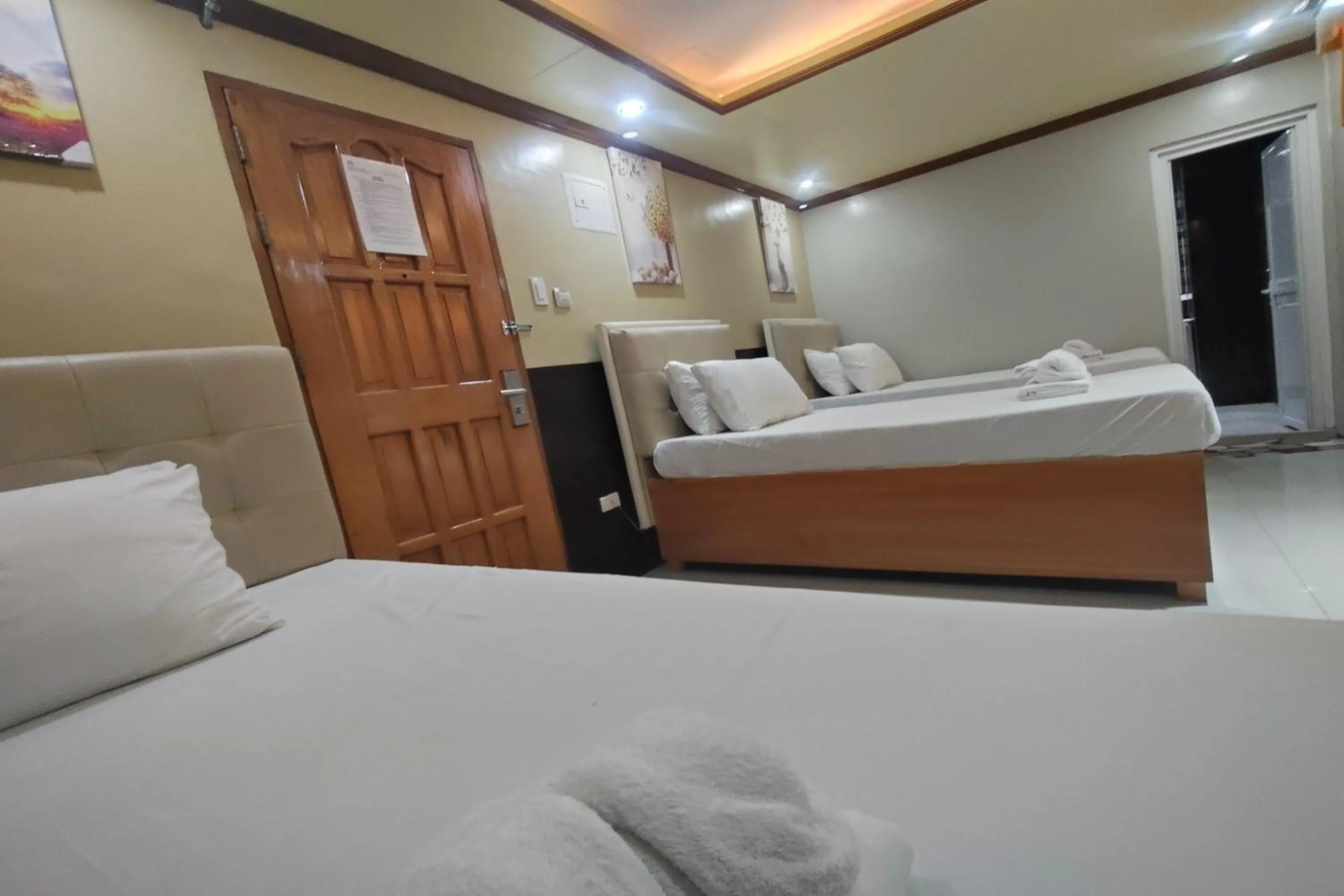 Photo of the whole room, Bed in Taj Hotel Tuguegarao