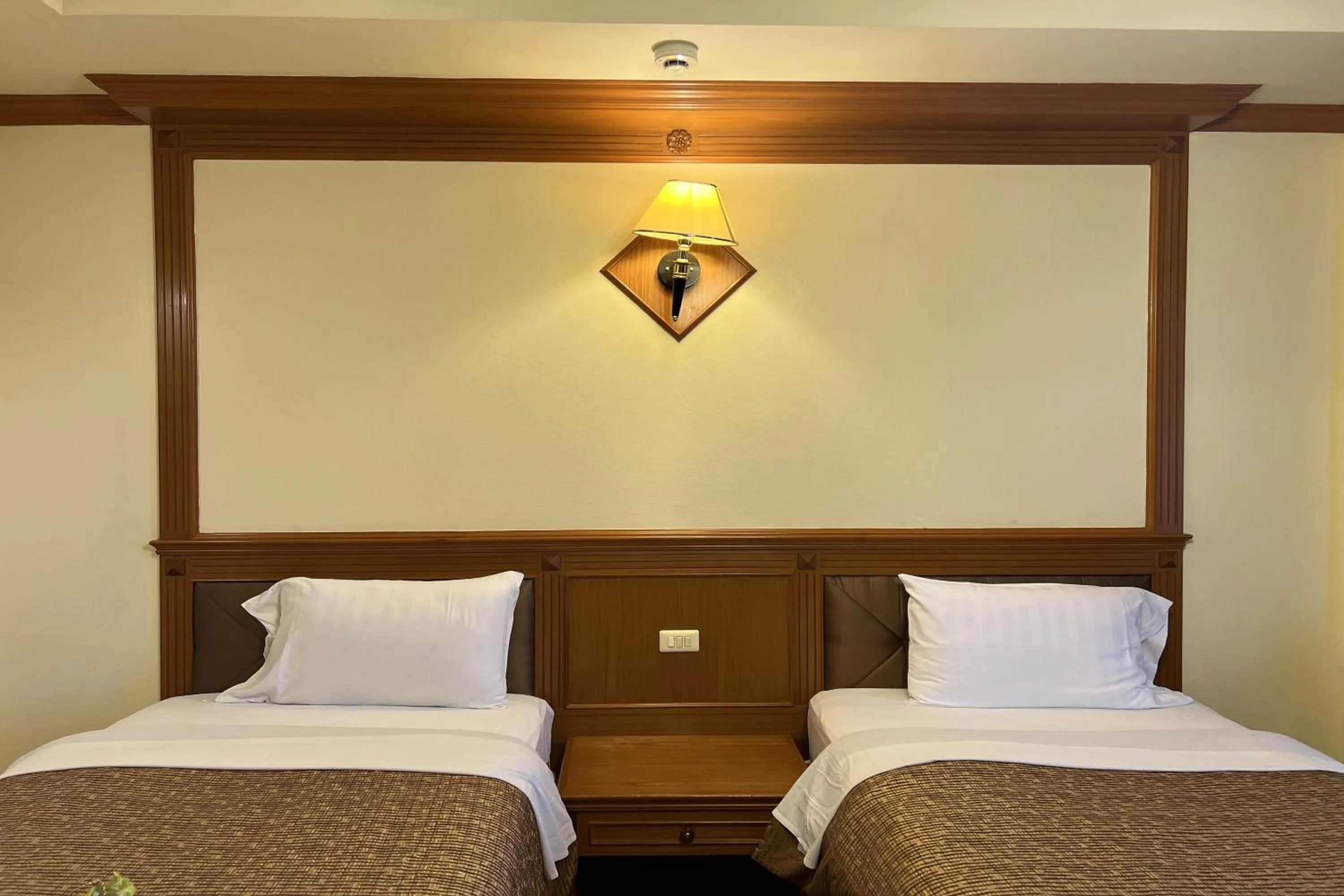 Bed in Taksila Hotel