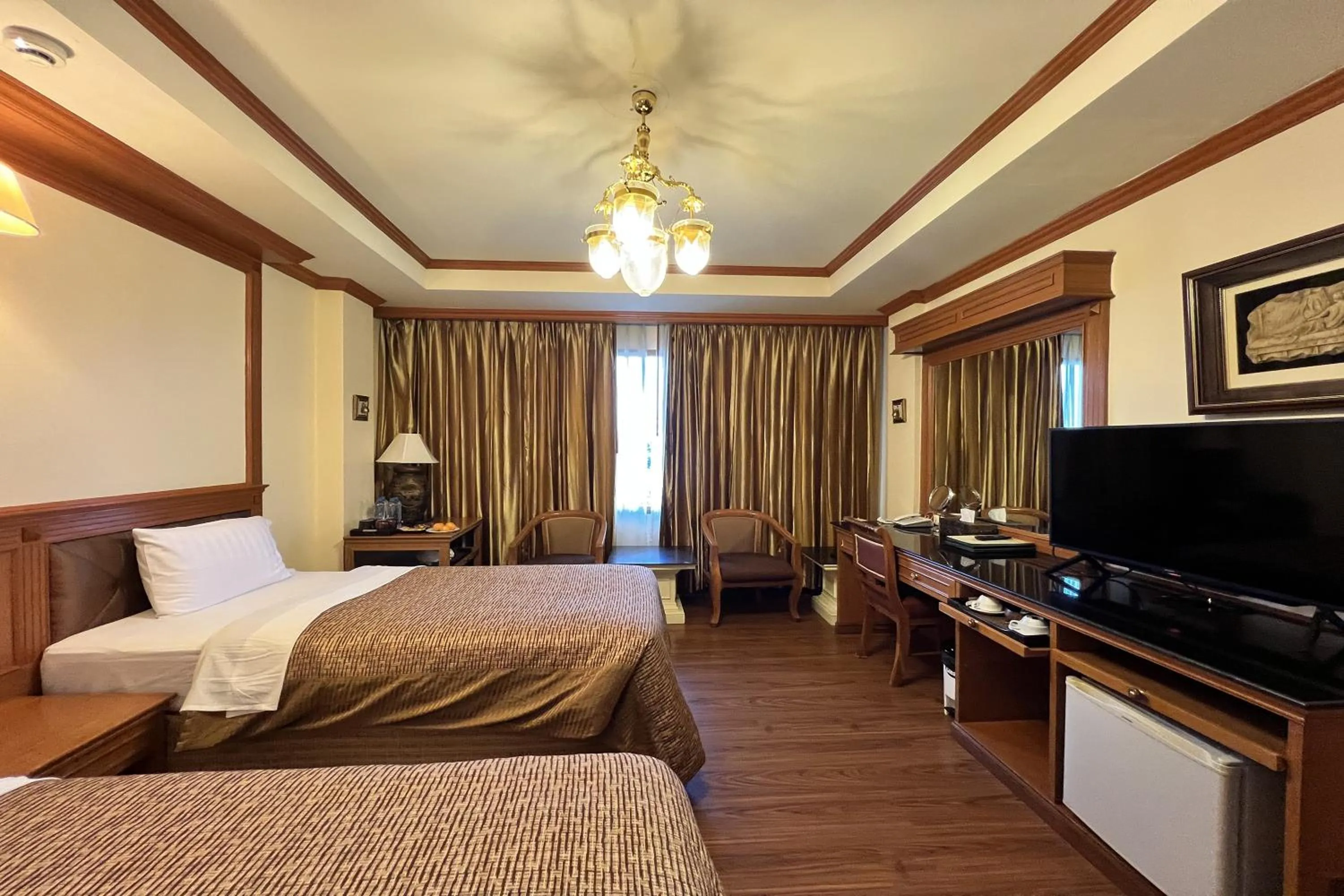 Bed in Taksila Hotel