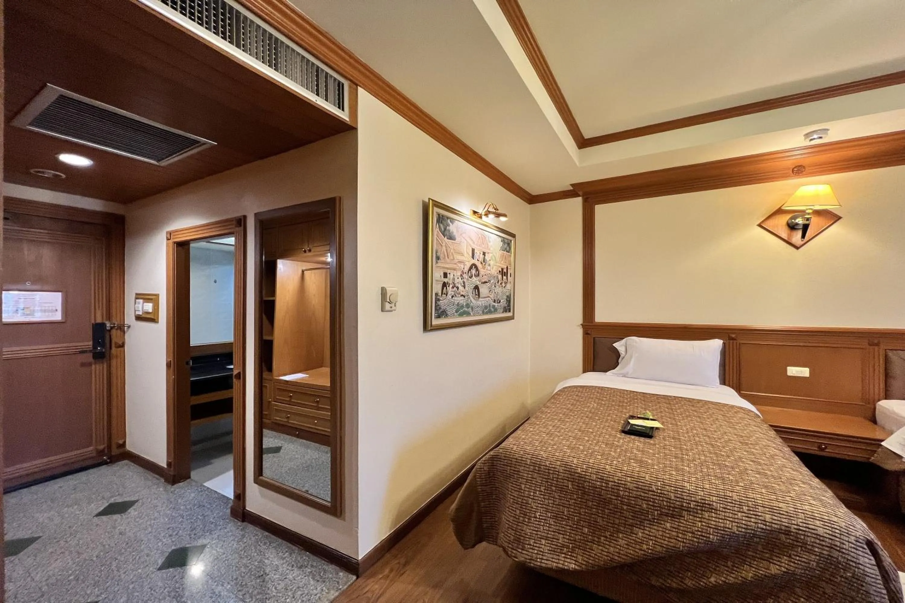 Bed in Taksila Hotel