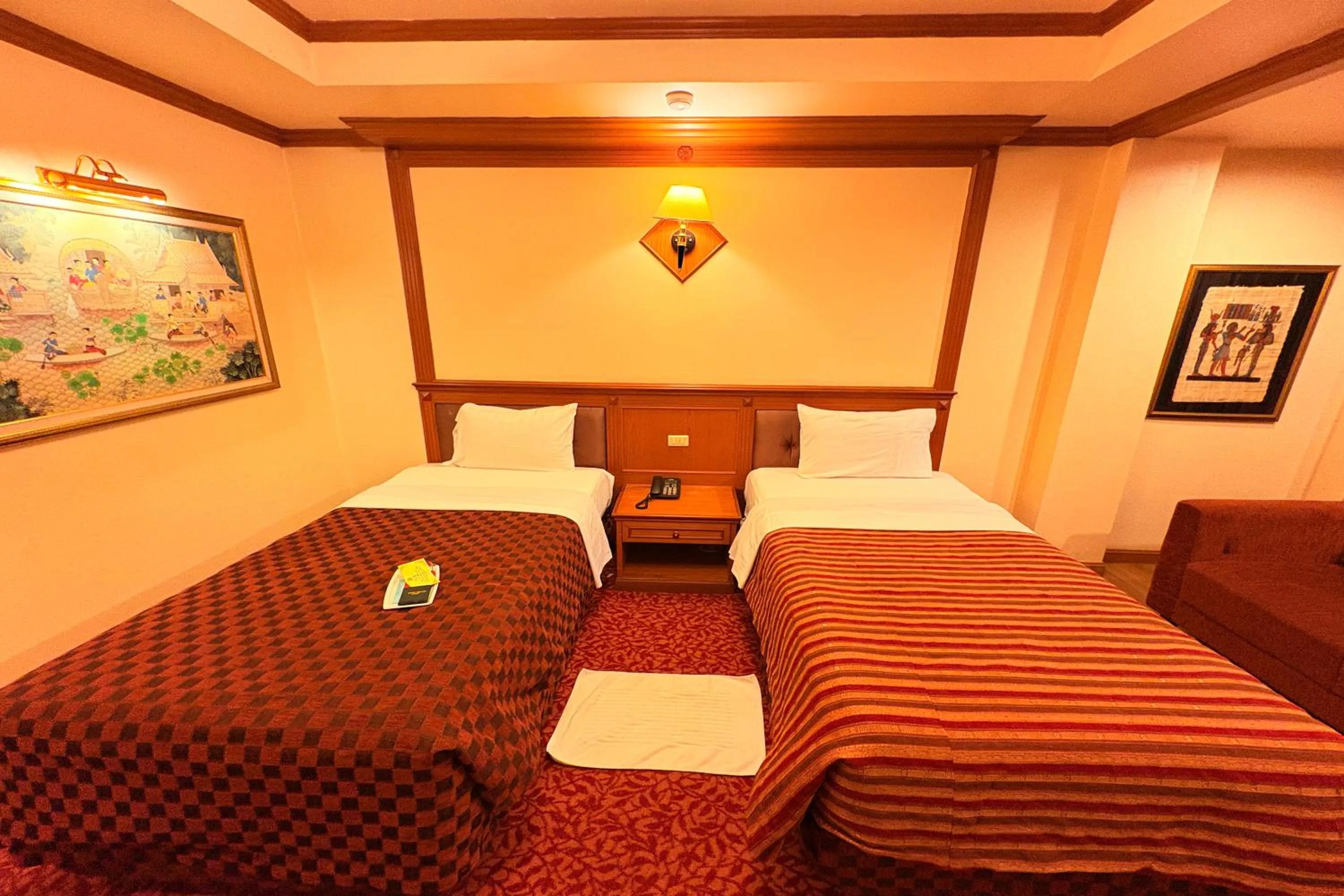 Bed in Taksila Hotel