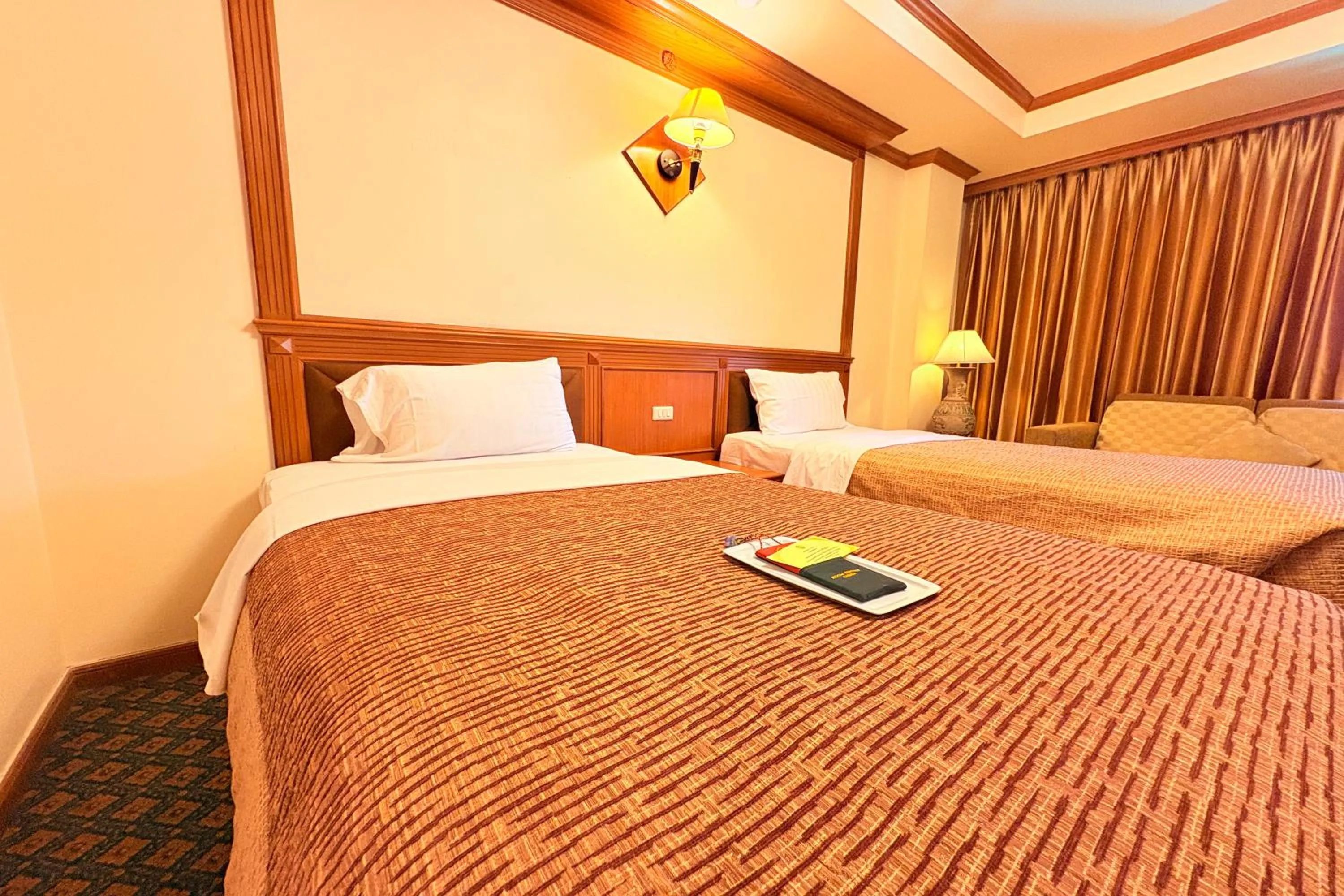 Bed in Taksila Hotel