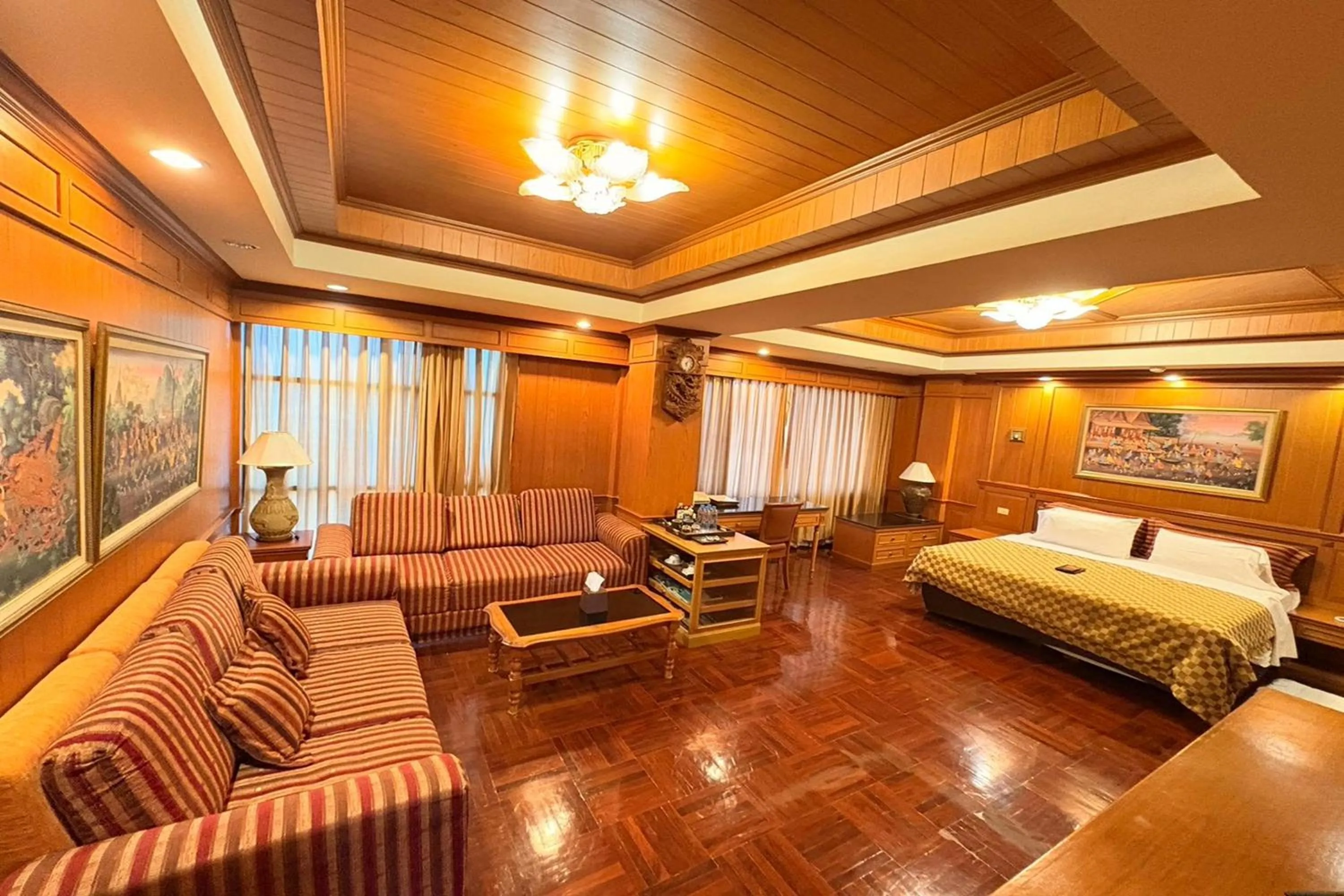 Living room, Bed in Taksila Hotel