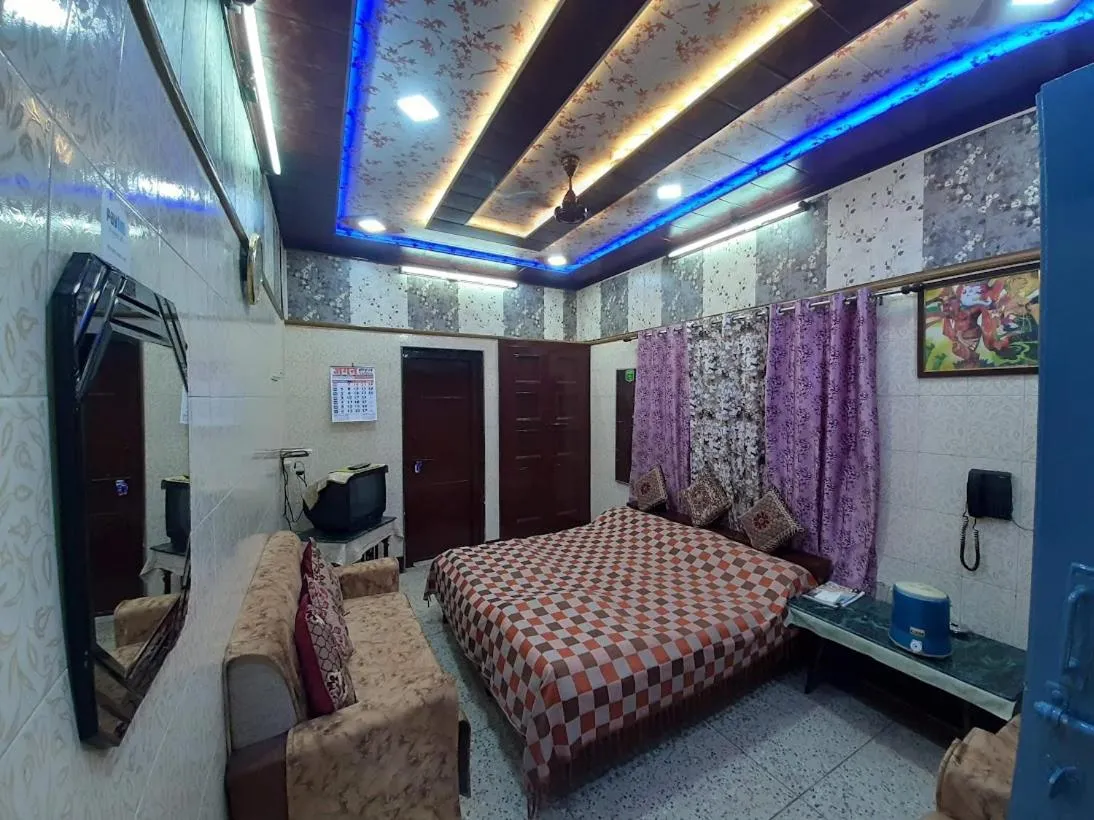 Living room, Bed in Jagan Hotel & Restaurant