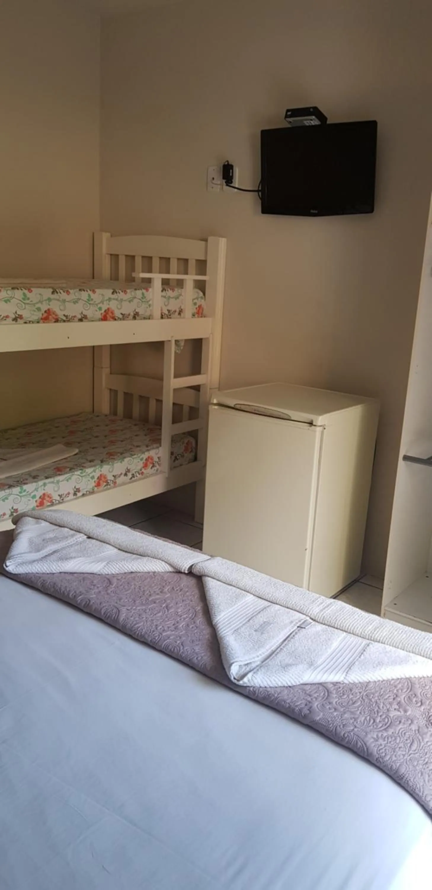 Bed in Pousada Guaruja