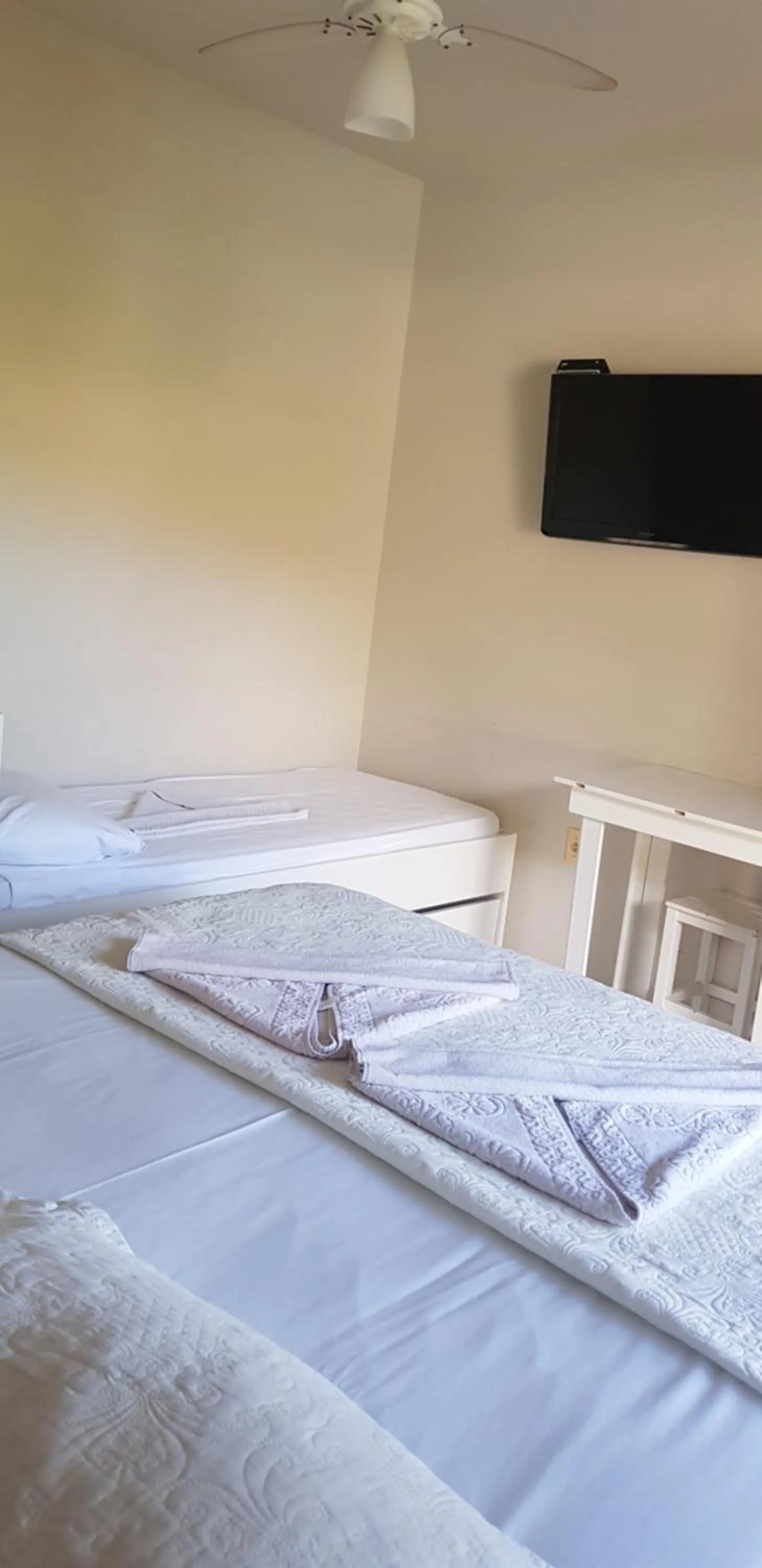 Bed in Pousada Guaruja