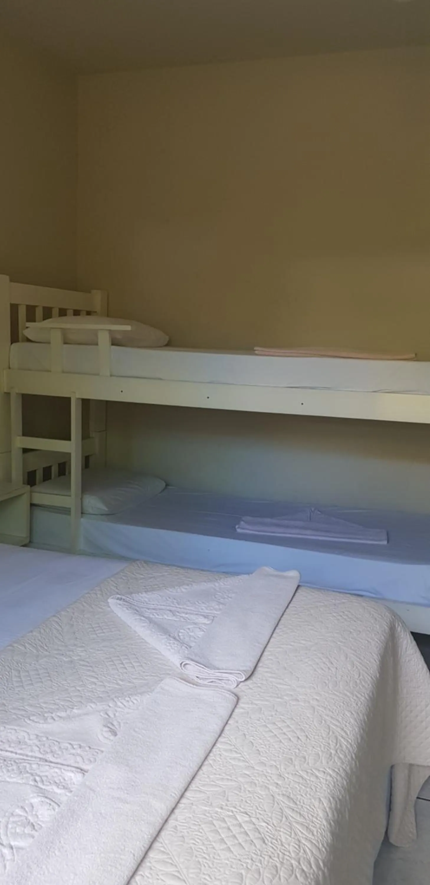 Bed in Pousada Guaruja