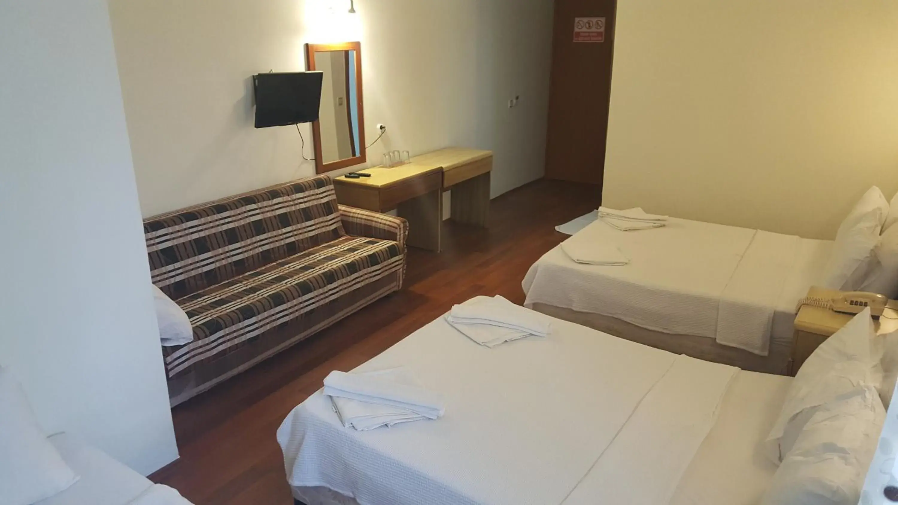 Standard Quadruple Room with Balcony in Hotel Berlin Standard Quadruple Room with Balcony in Hotel Berlin