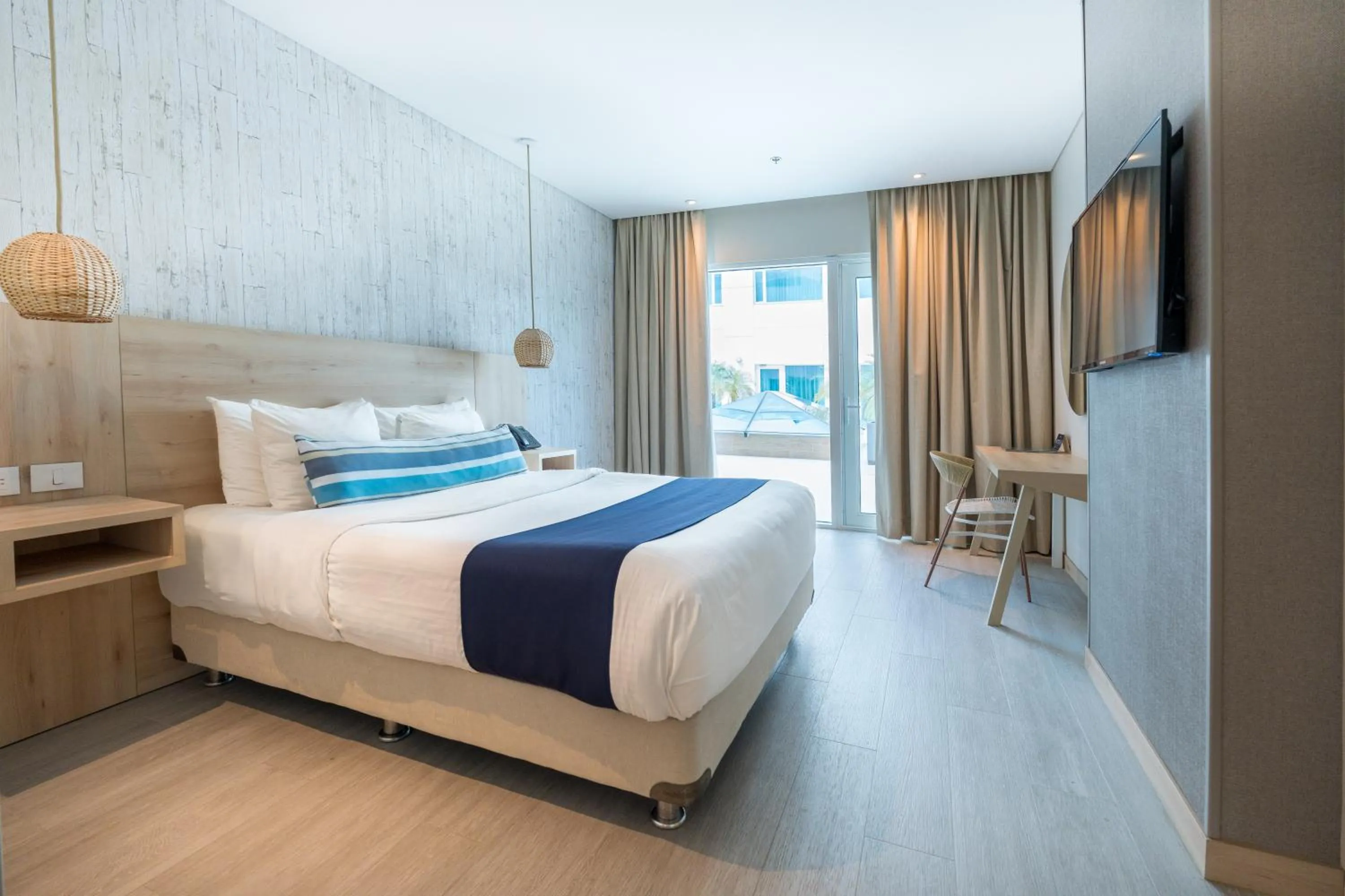 Bed in Aquamare Hotel