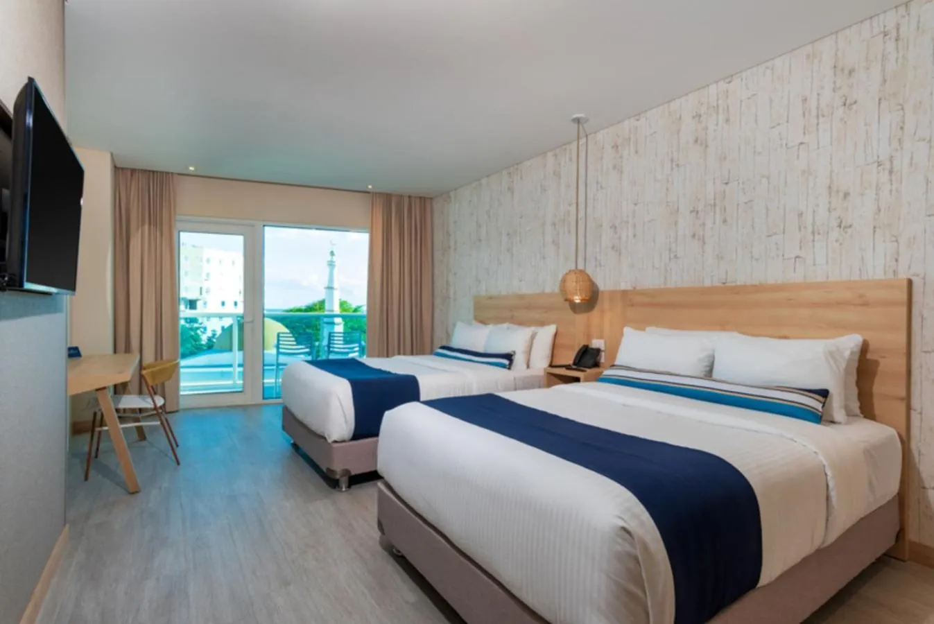 Bed in Aquamare Hotel