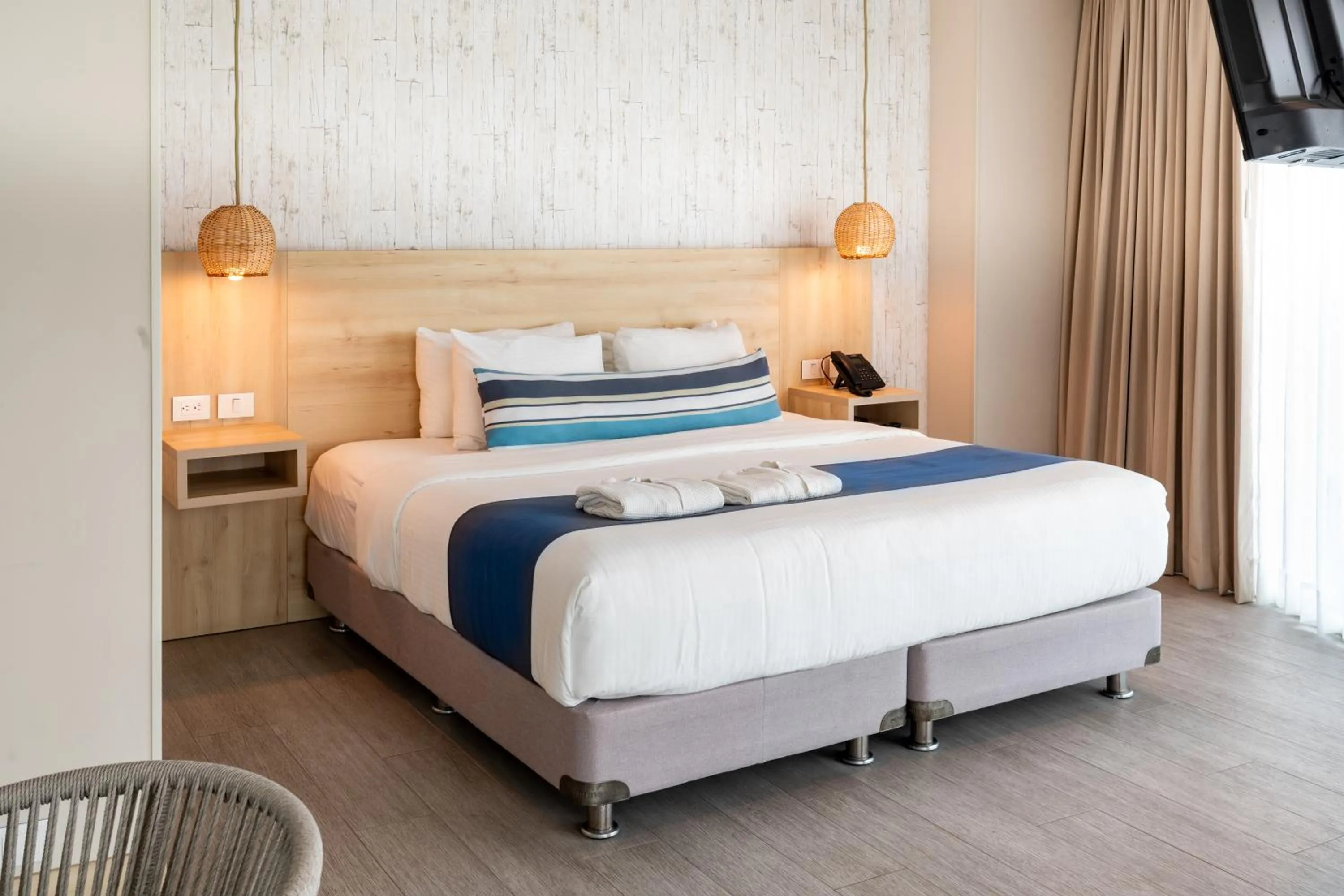 Bed in Aquamare Hotel