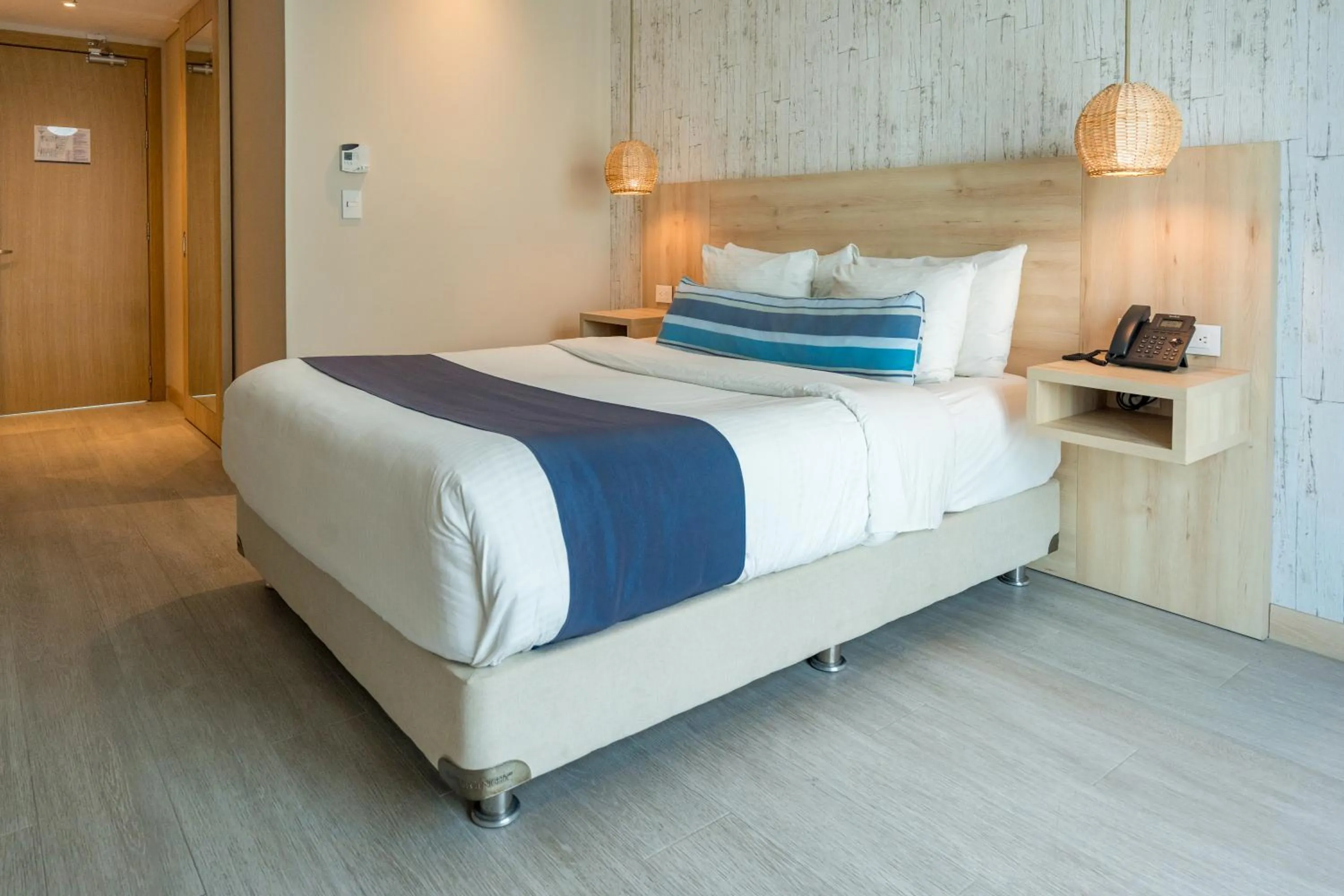 Bed in Aquamare Hotel