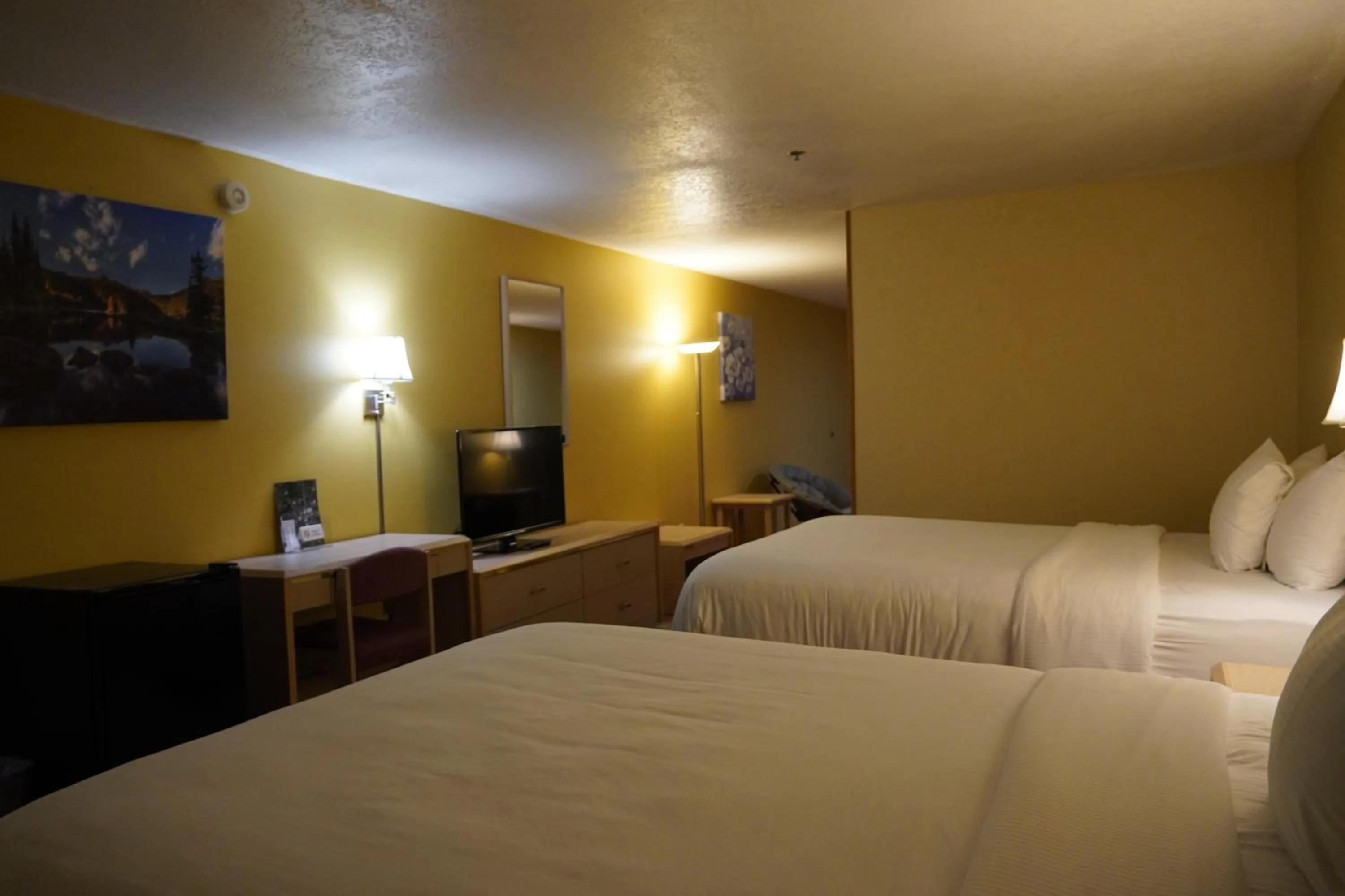 Bed in Timberland Inn & Suites