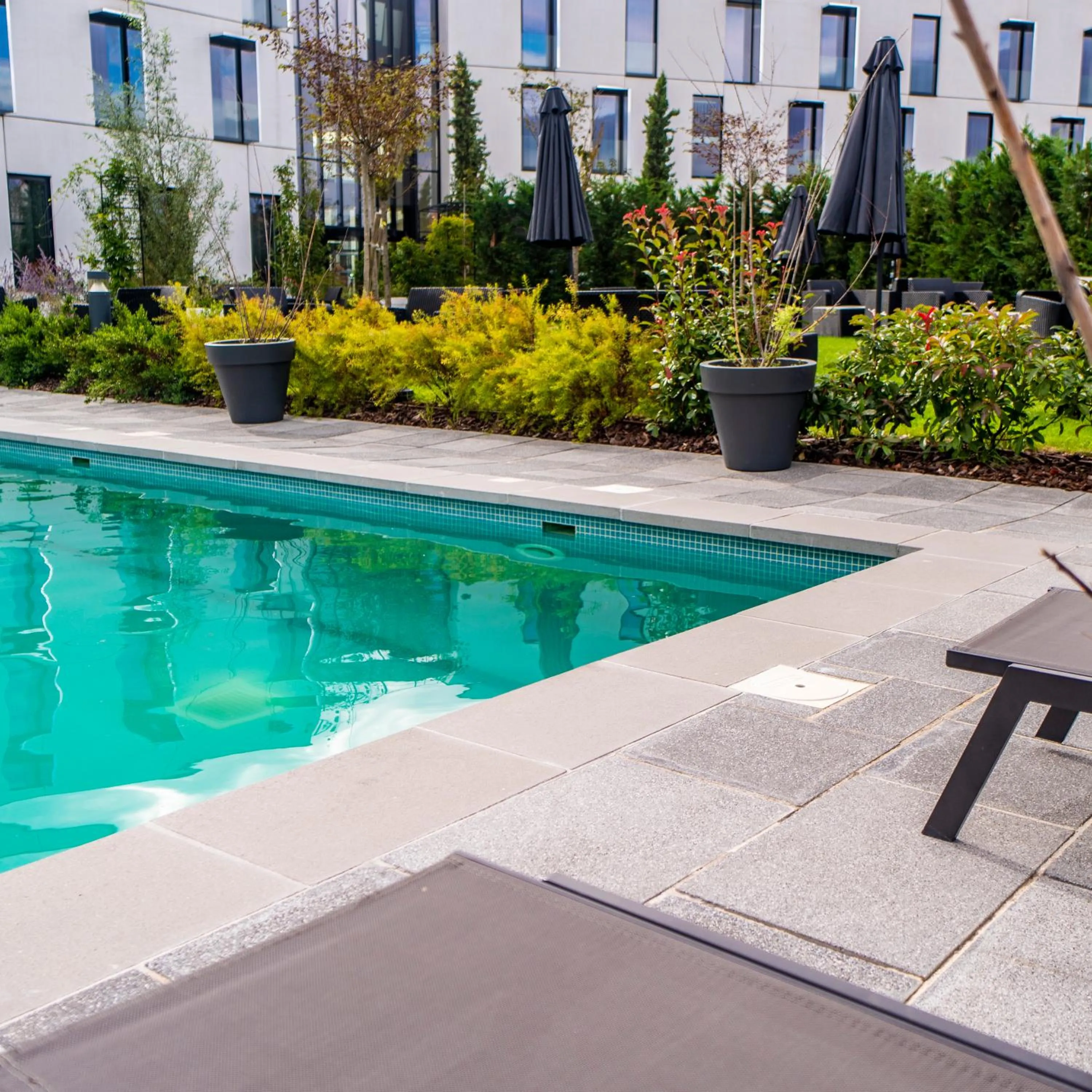 Swimming pool in Hotel Dali Val d'Europe, Tapestry Collection by Hilton