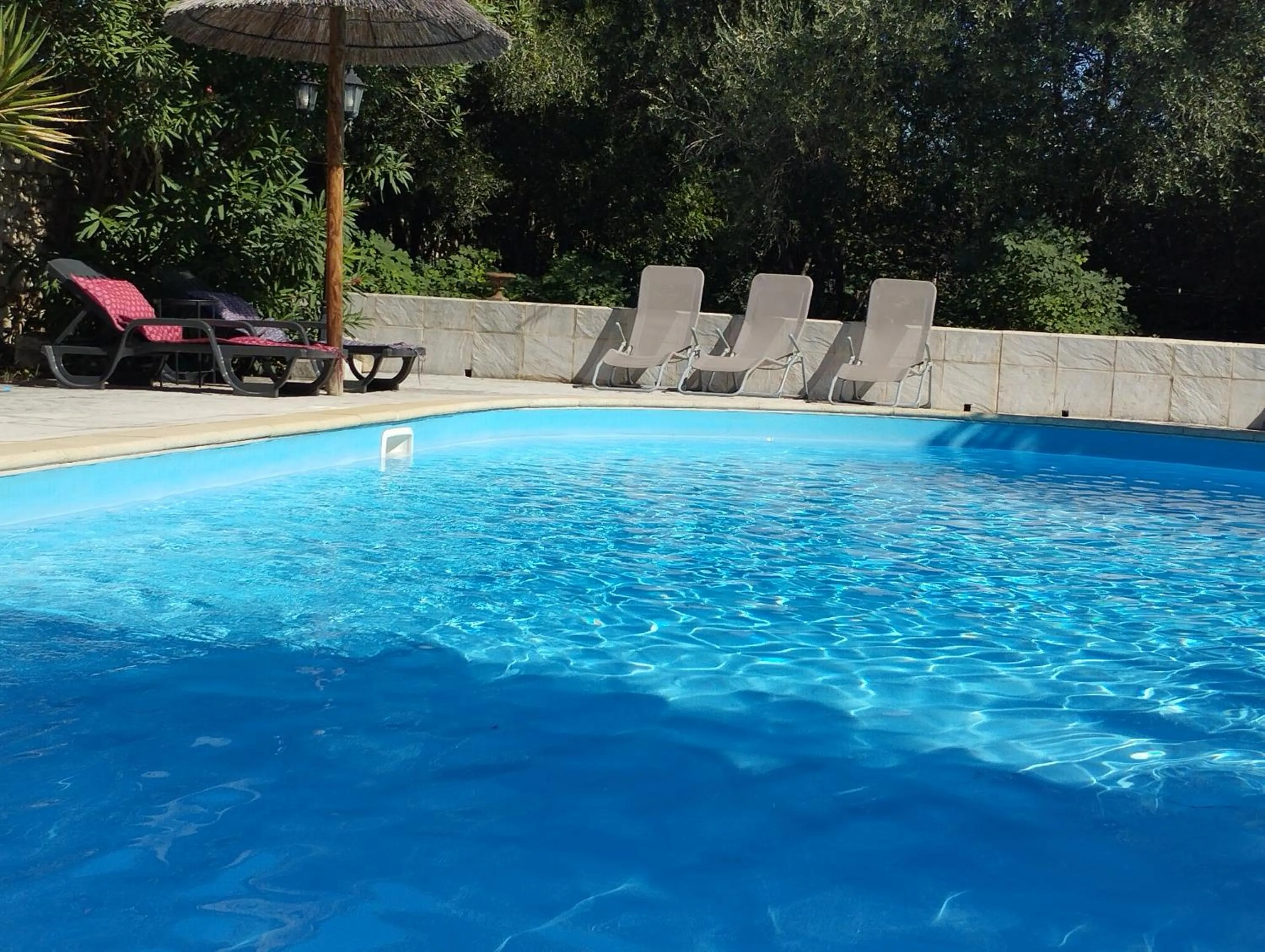 Swimming pool in Logis Hotel Restaurant L'Esquielle